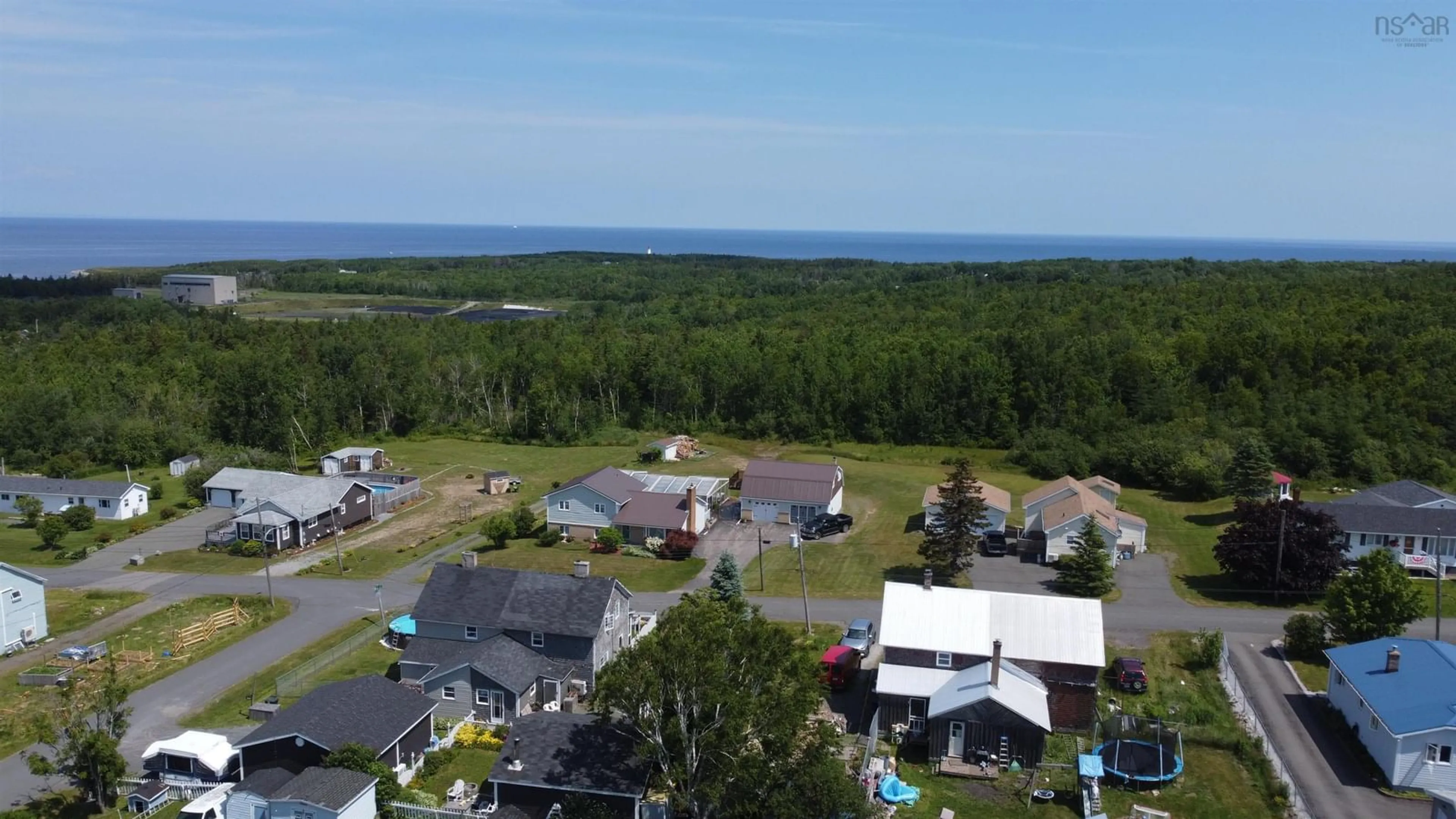 A pic from outside/outdoor area/front of a property/back of a property/a pic from drone, water/lake/river/ocean view for 122 Daley Rd, New Victoria Nova Scotia B1H 4Z8