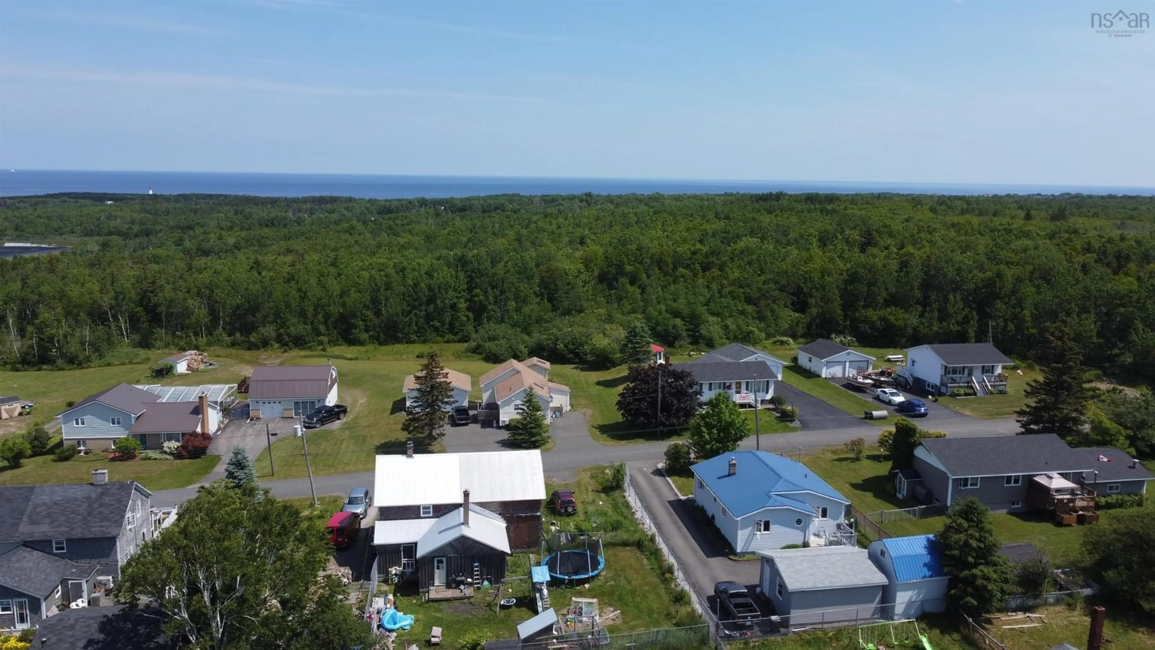 A pic from outside/outdoor area/front of a property/back of a property/a pic from drone, water/lake/river/ocean view for 122 Daley Rd, New Victoria Nova Scotia B1H 4Z8