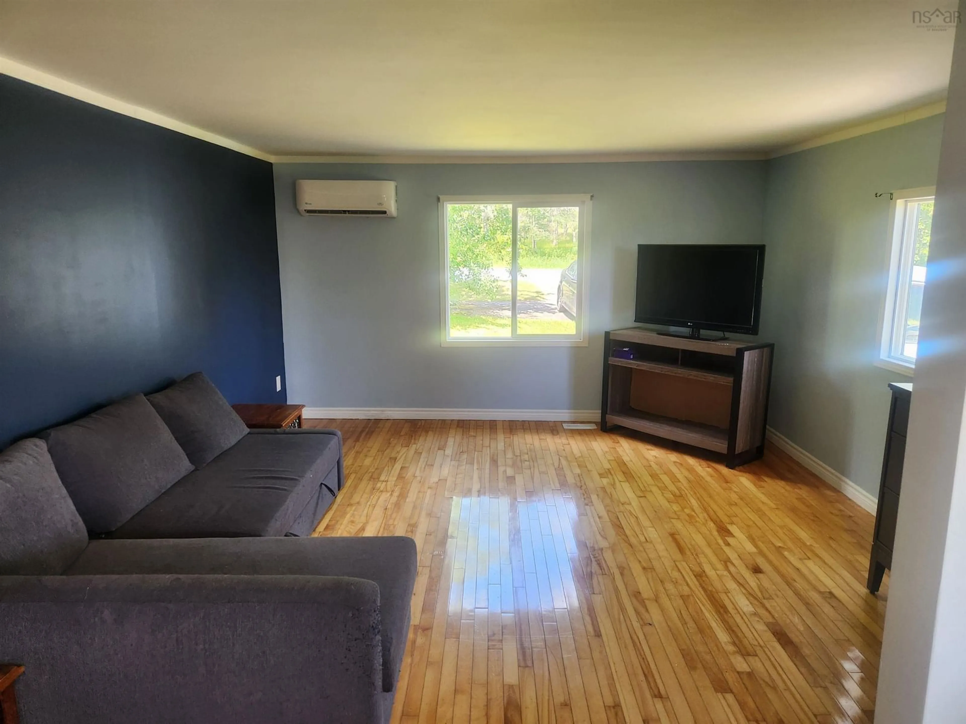 Living room with furniture, wood/laminate floor for 2403 West Ship Harbour Rd, Owls Head Nova Scotia B0J 2L0