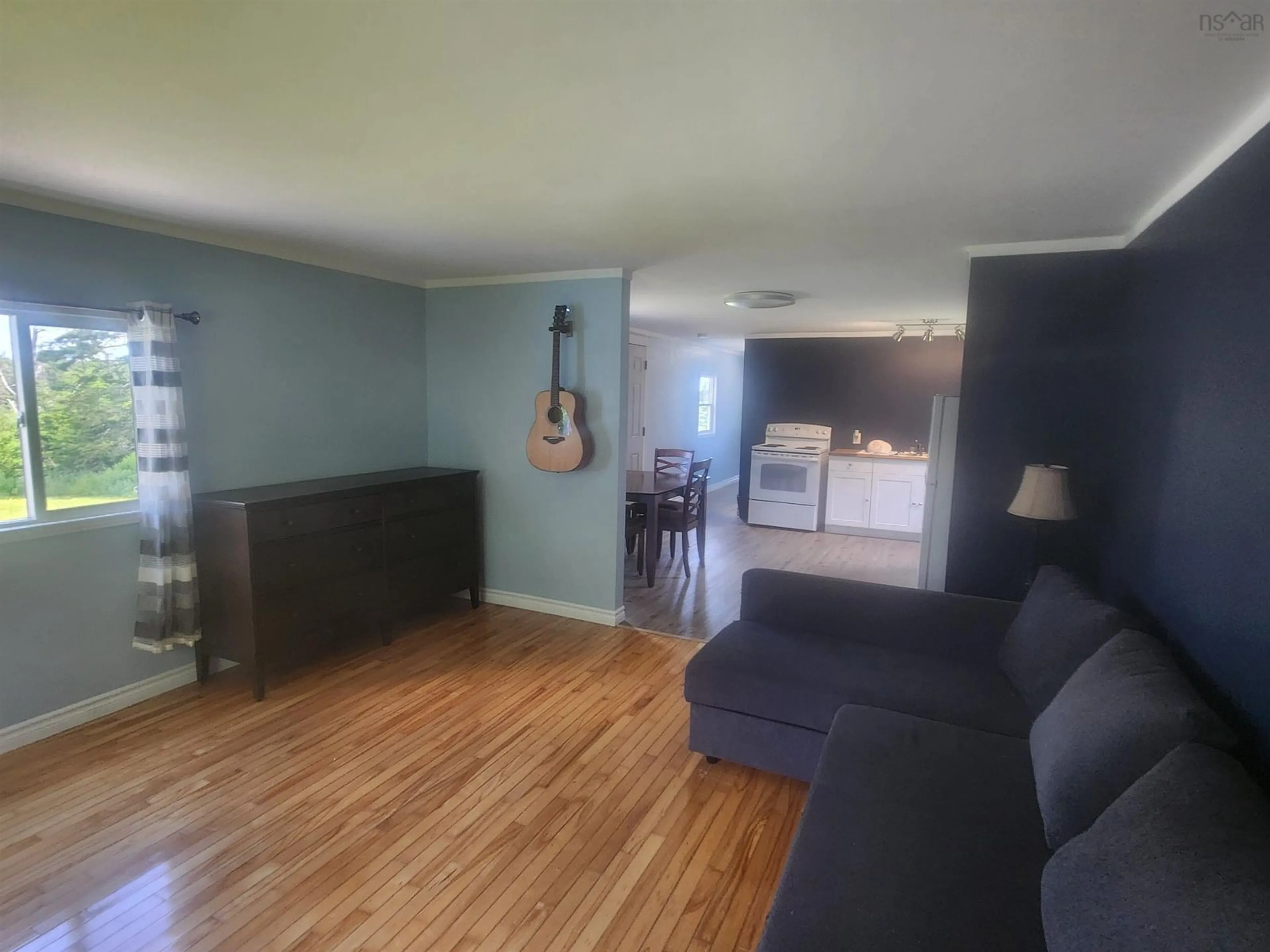Living room with furniture, wood/laminate floor for 2403 West Ship Harbour Rd, Owls Head Nova Scotia B0J 2L0