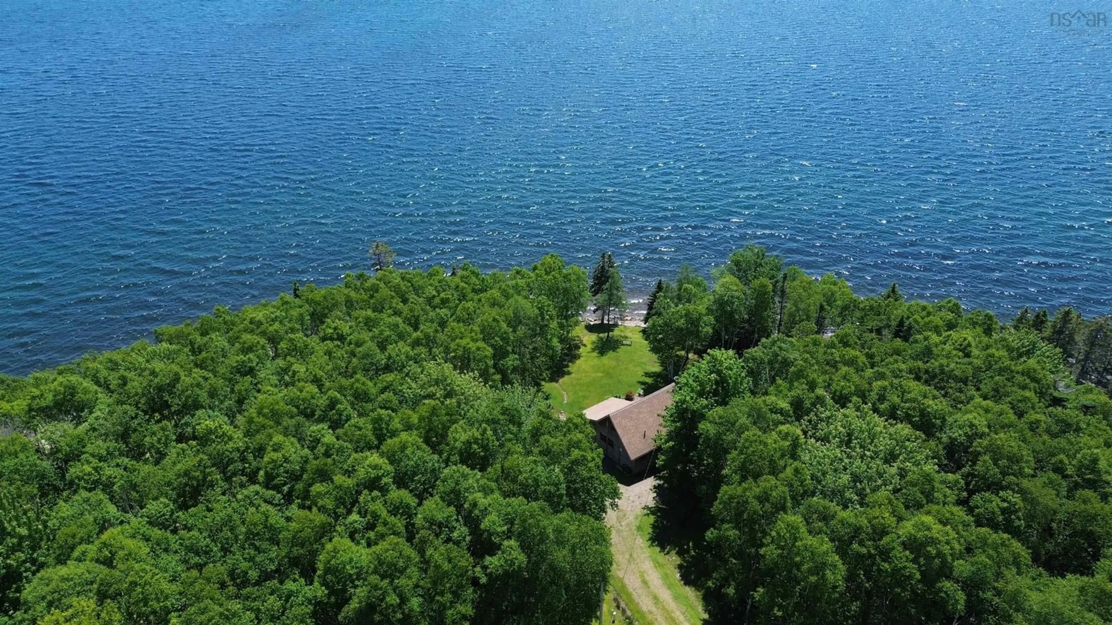 A pic from outside/outdoor area/front of a property/back of a property/a pic from drone, water/lake/river/ocean view for 64 Birch Pond Lane, West Bay Marshes Nova Scotia B0E 2Y0