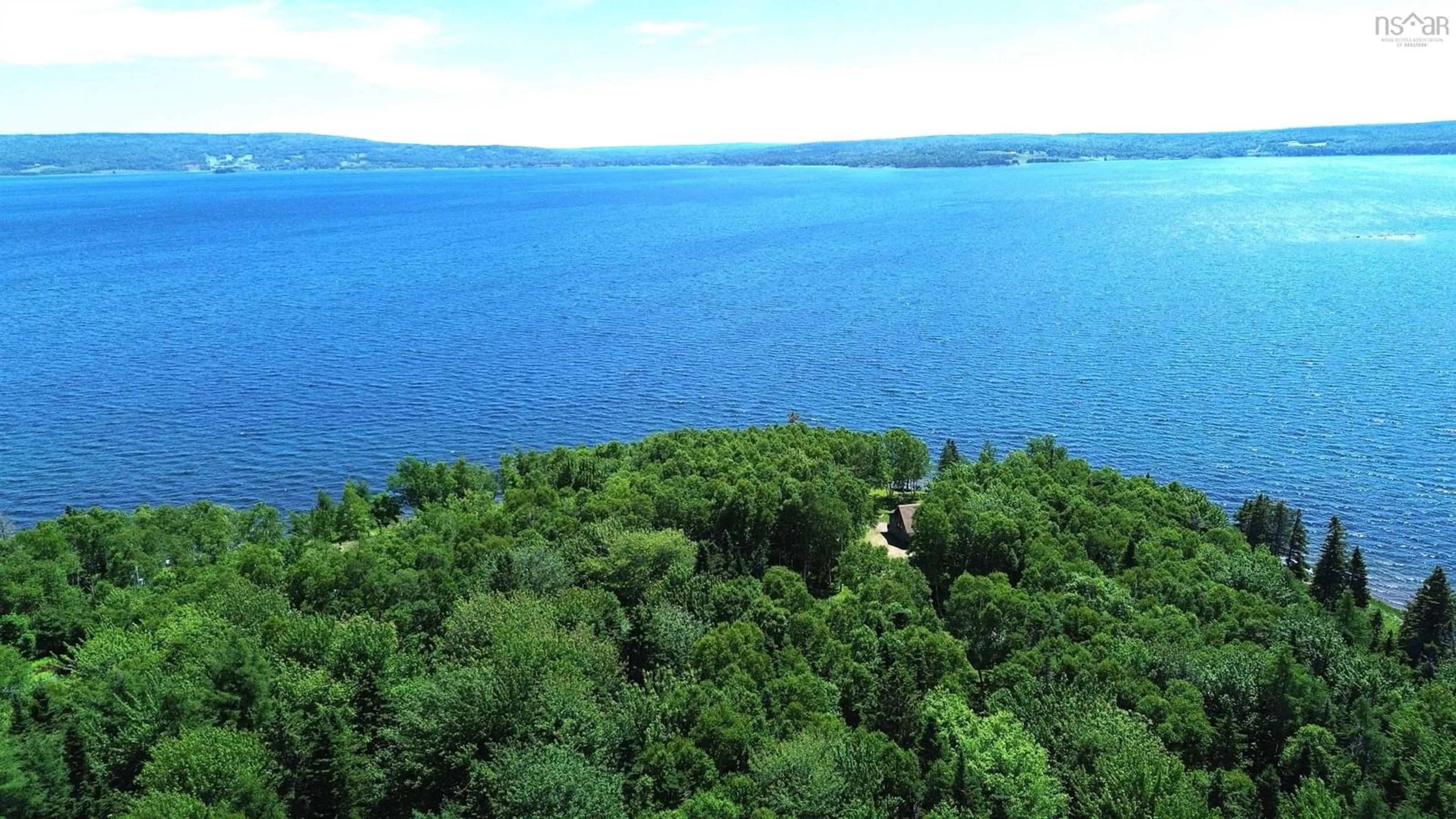 A pic from outside/outdoor area/front of a property/back of a property/a pic from drone, water/lake/river/ocean view for 64 Birch Pond Lane, West Bay Marshes Nova Scotia B0E 2Y0