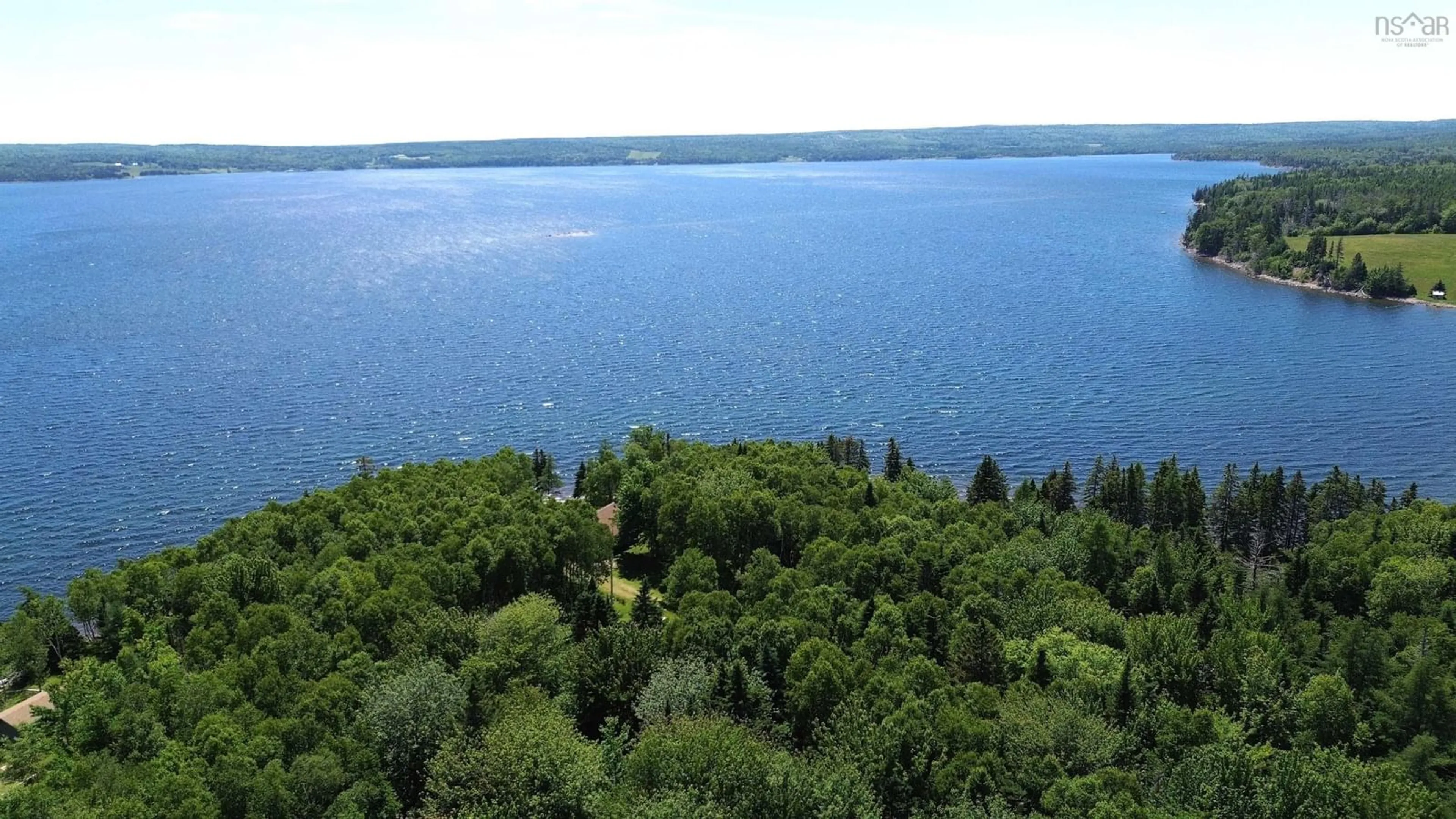 A pic from outside/outdoor area/front of a property/back of a property/a pic from drone, water/lake/river/ocean view for 64 Birch Pond Lane, West Bay Marshes Nova Scotia B0E 2Y0
