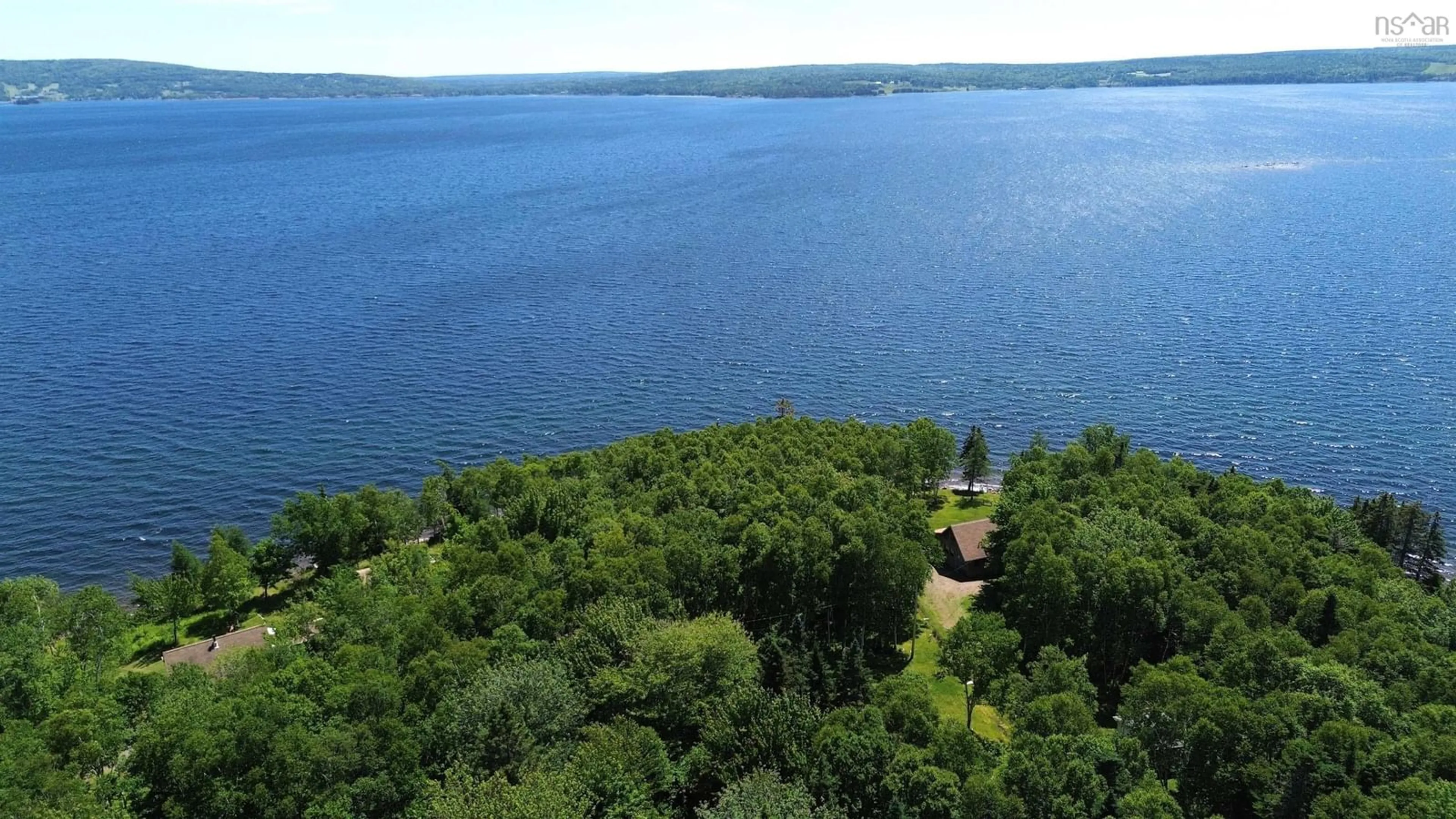 A pic from outside/outdoor area/front of a property/back of a property/a pic from drone, water/lake/river/ocean view for 64 Birch Pond Lane, West Bay Marshes Nova Scotia B0E 2Y0