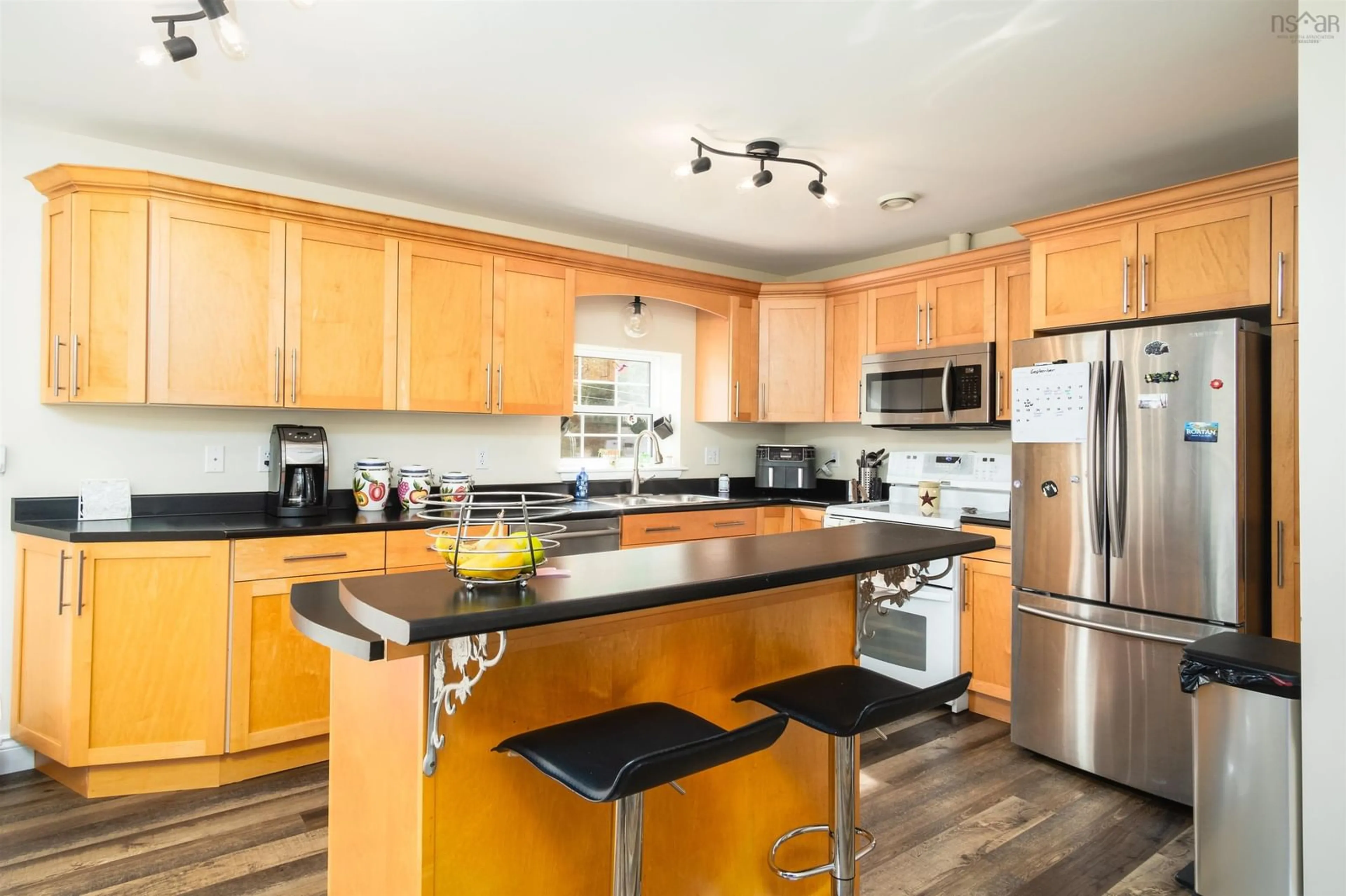 Open concept kitchen, wood/laminate floor for 40 Mountainview Dr, Troy Nova Scotia B9A 1G8
