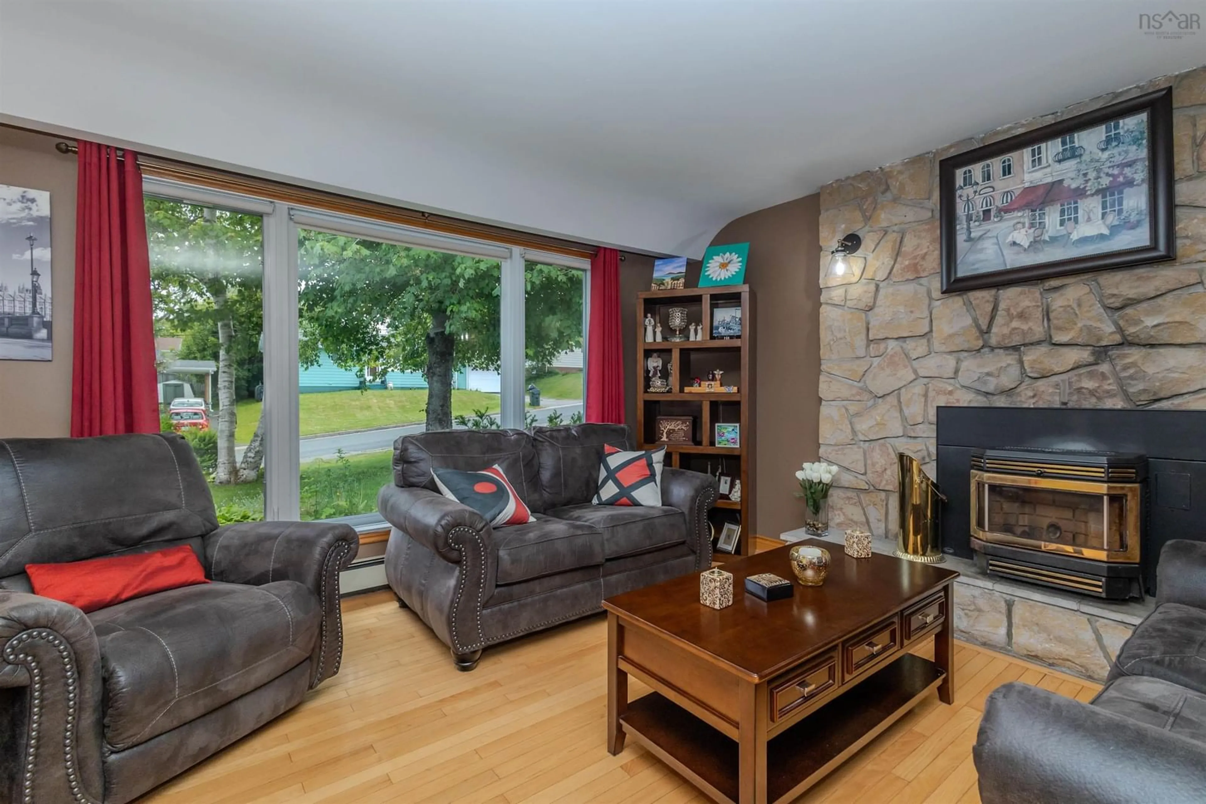Living room with furniture, wood/laminate floor for 91 Common St, Sydney Nova Scotia B1P 3L3
