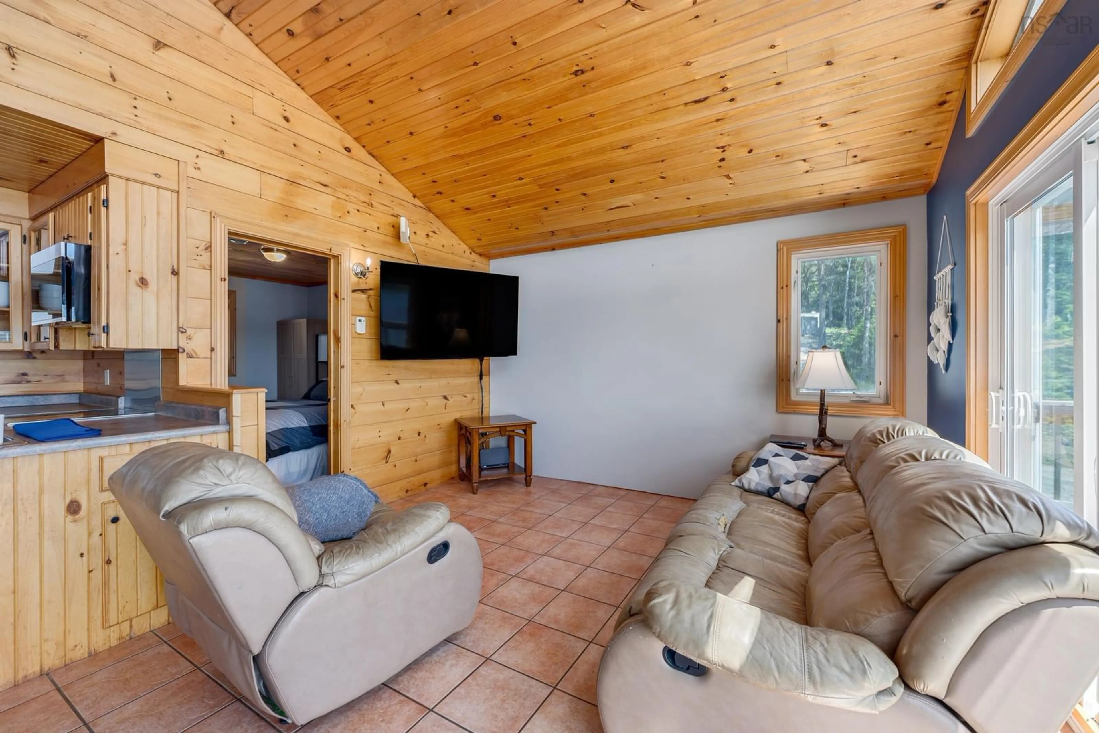 Living room with furniture, wood/laminate floor for 144 Orchard Lane, Corberrie Nova Scotia B0W 3T0