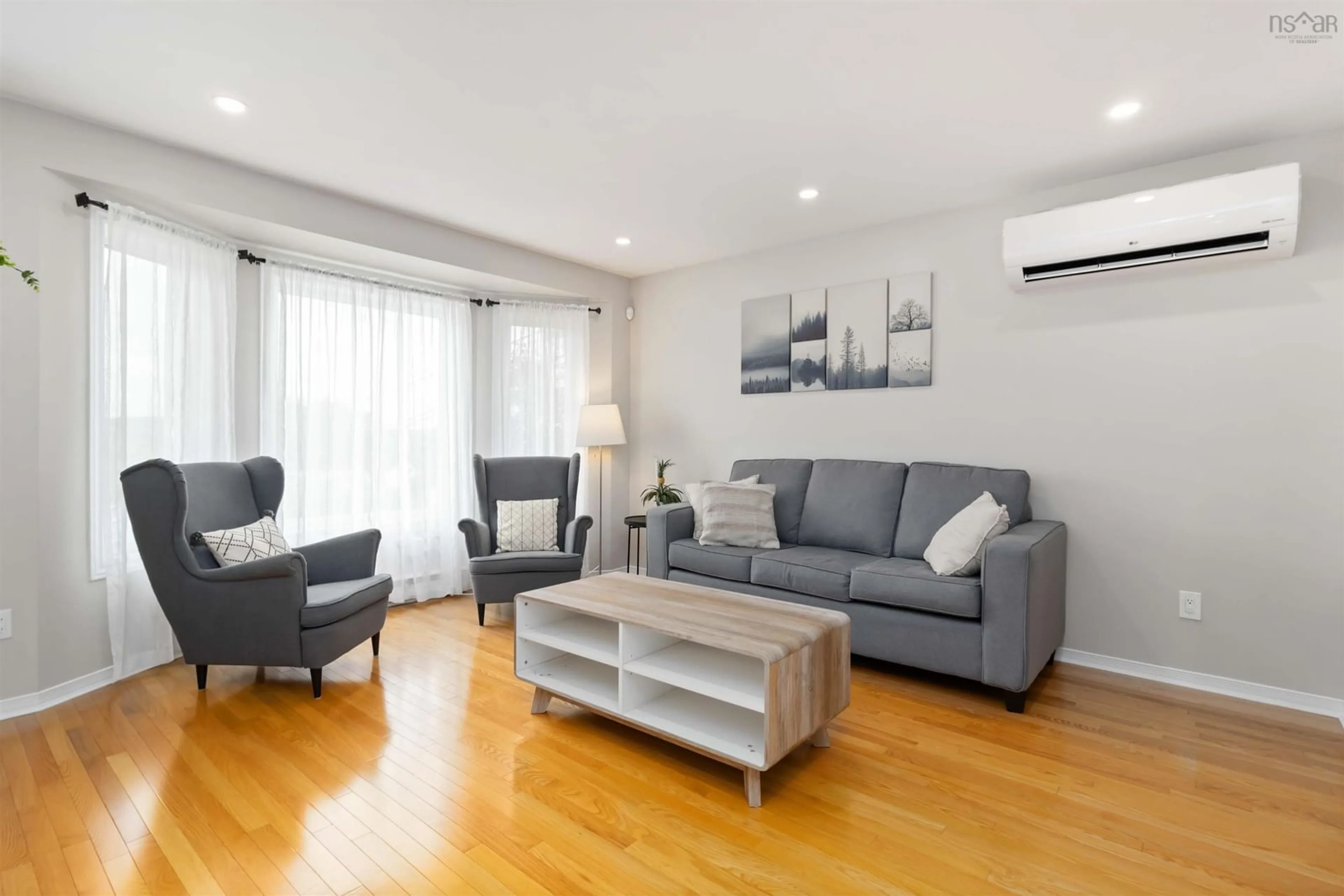 Living room with furniture, wood/laminate floor for 14 Braemont Crt, Middle Sackville Nova Scotia B4E 3A1