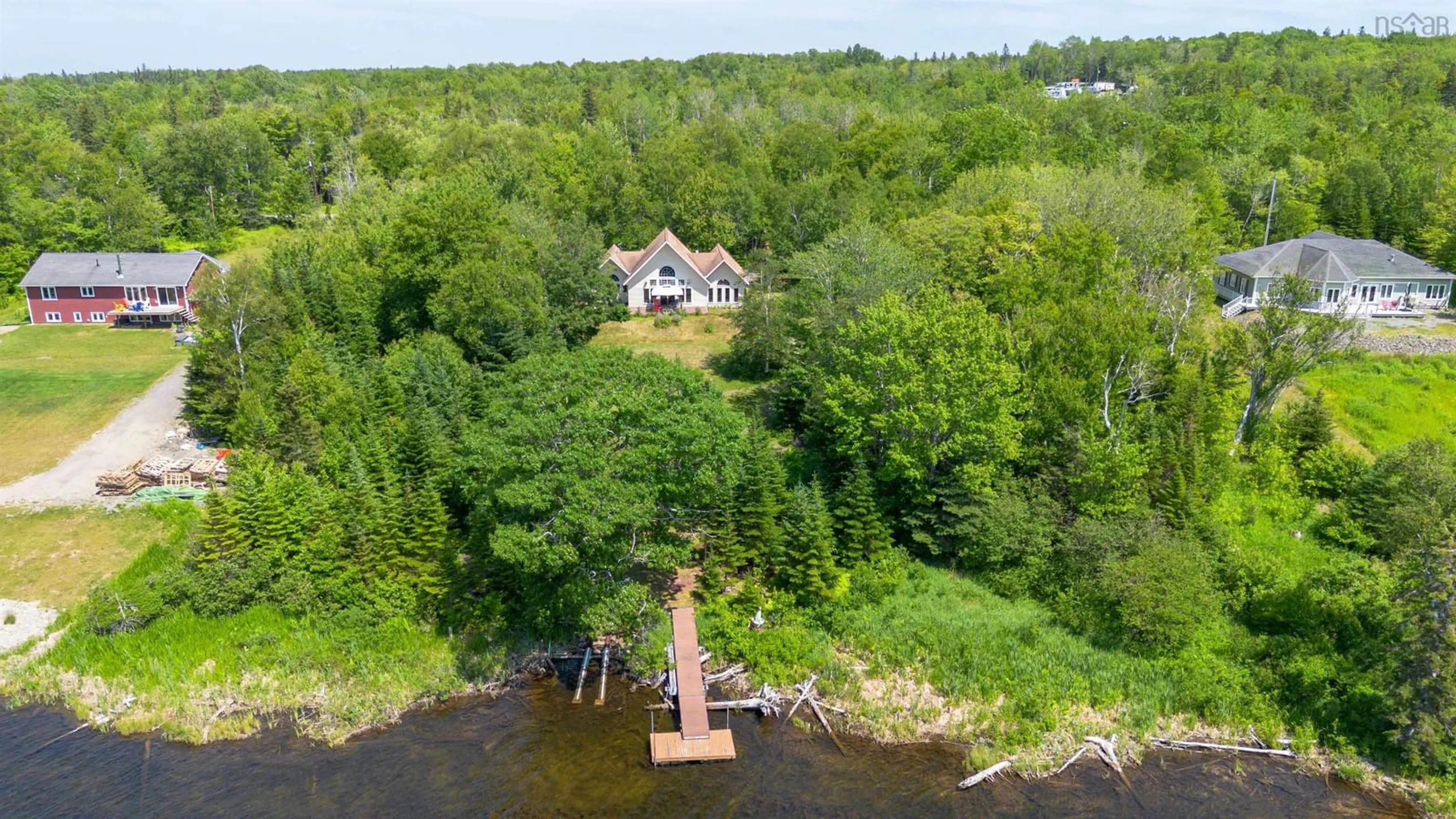 A pic from outside/outdoor area/front of a property/back of a property/a pic from drone, water/lake/river/ocean view for 54 Beverlys Hill Rd, Baddeck Inlet Nova Scotia B0E 1B0