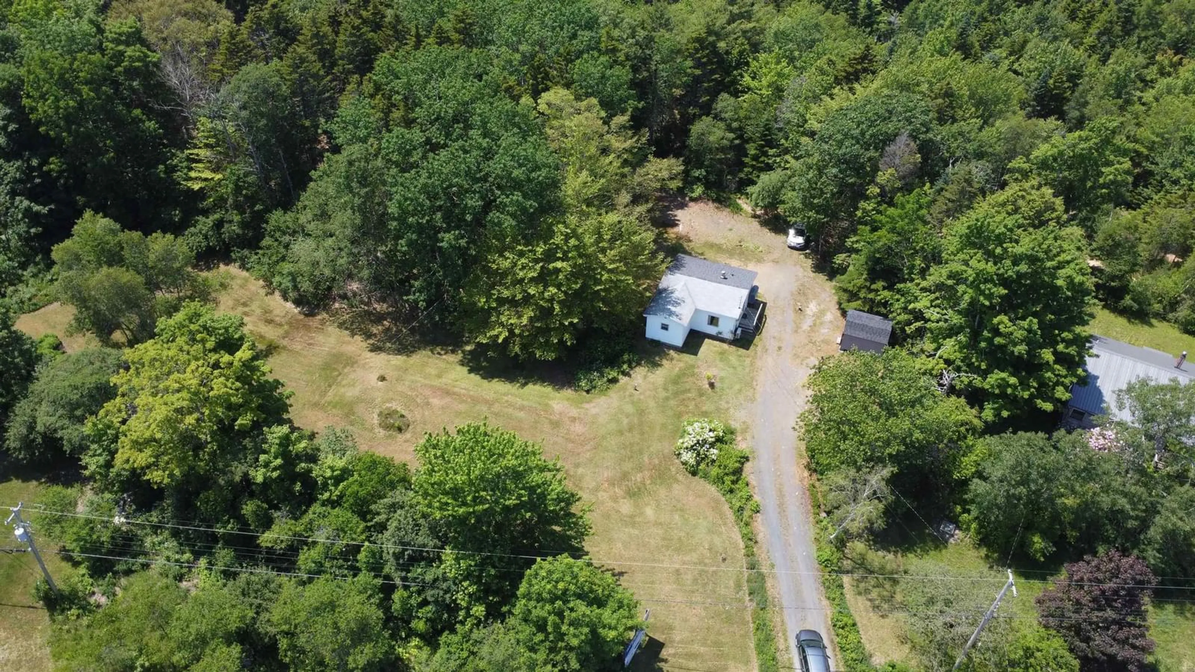 A pic from outside/outdoor area/front of a property/back of a property/a pic from drone, forest/trees view for 16498 Highway 103, Hebbs Cross Nova Scotia B4V 0Y9