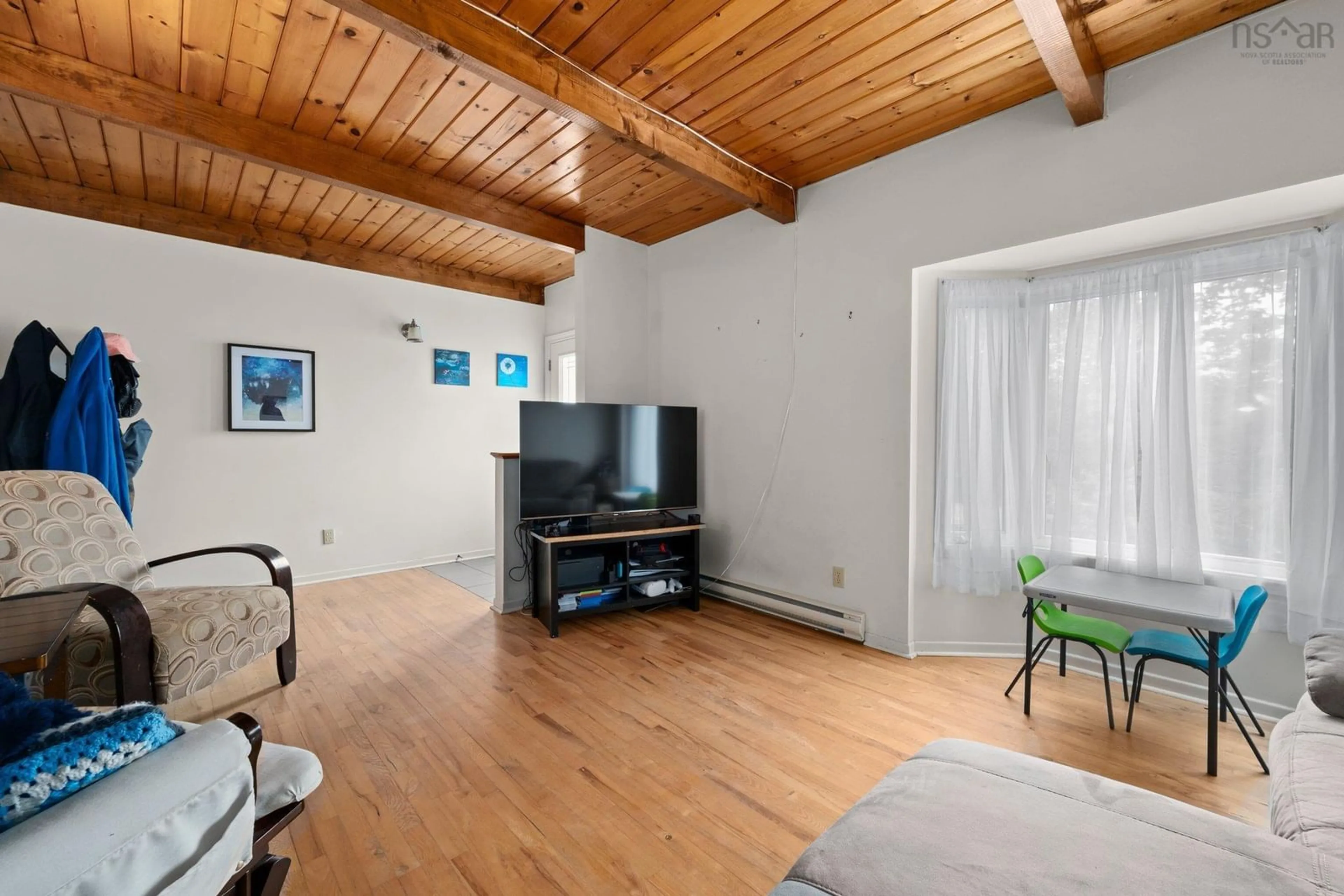 Living room with furniture, wood/laminate floor for 79 Matador Crt, Lower Sackville Nova Scotia B4C 3G9