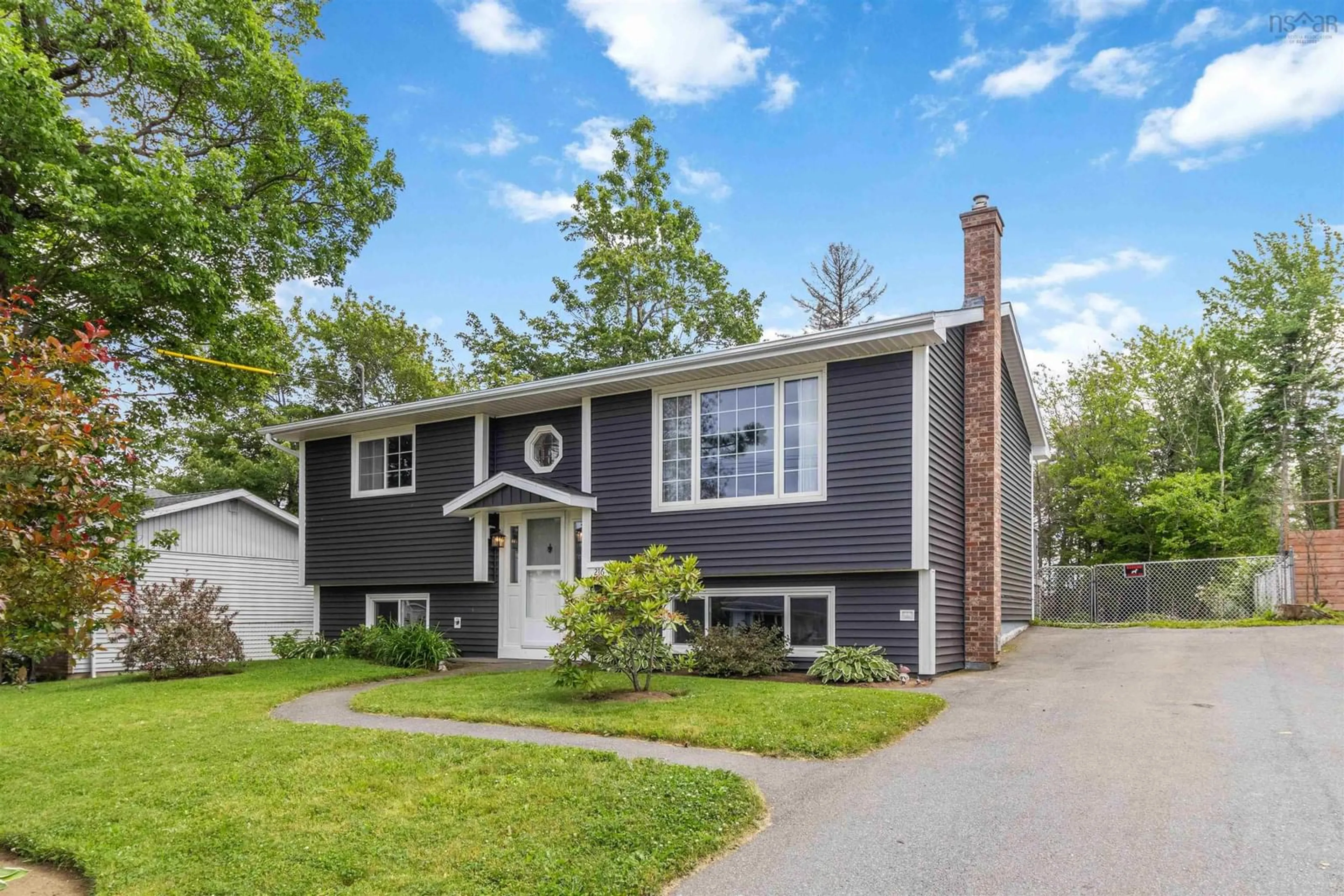 Home with vinyl exterior material, street for 216 Cavalier Dr, Lower Sackville Nova Scotia B4C 3L9