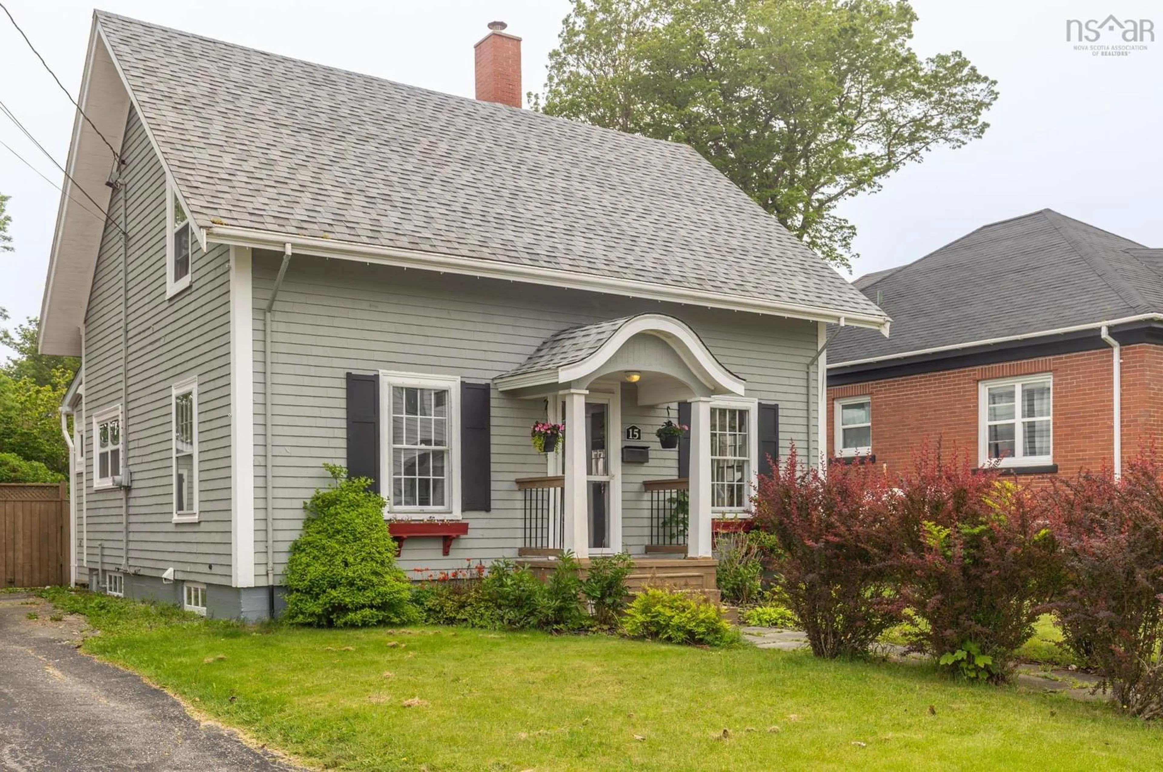 Home with vinyl exterior material, street for 15 Grand St, Yarmouth Nova Scotia B5A 2Z7