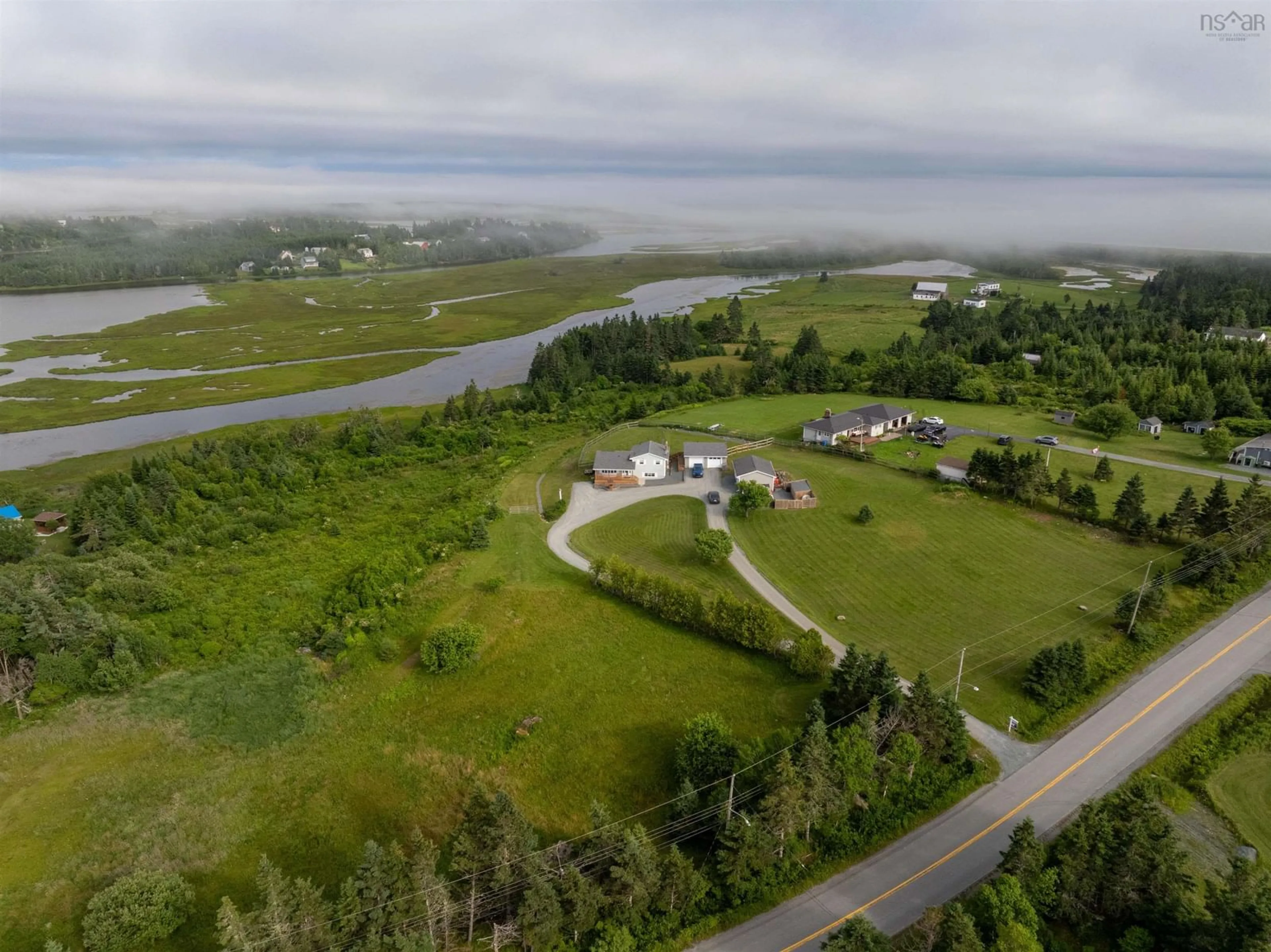 A pic from outside/outdoor area/front of a property/back of a property/a pic from drone, water/lake/river/ocean view for 408 West Lawrencetown Rd, Lawrencetown Nova Scotia B2Z 1S6