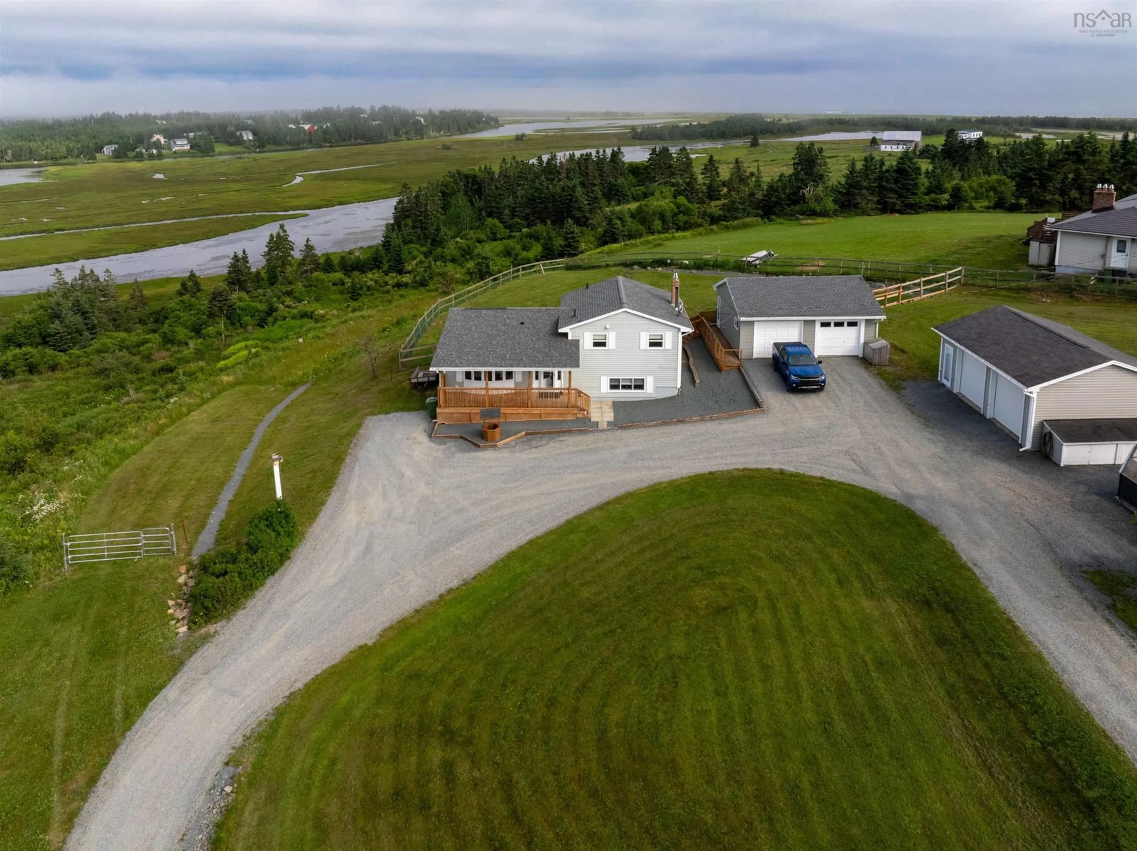 A pic from outside/outdoor area/front of a property/back of a property/a pic from drone, water/lake/river/ocean view for 408 West Lawrencetown Rd, Lawrencetown Nova Scotia B2Z 1S6