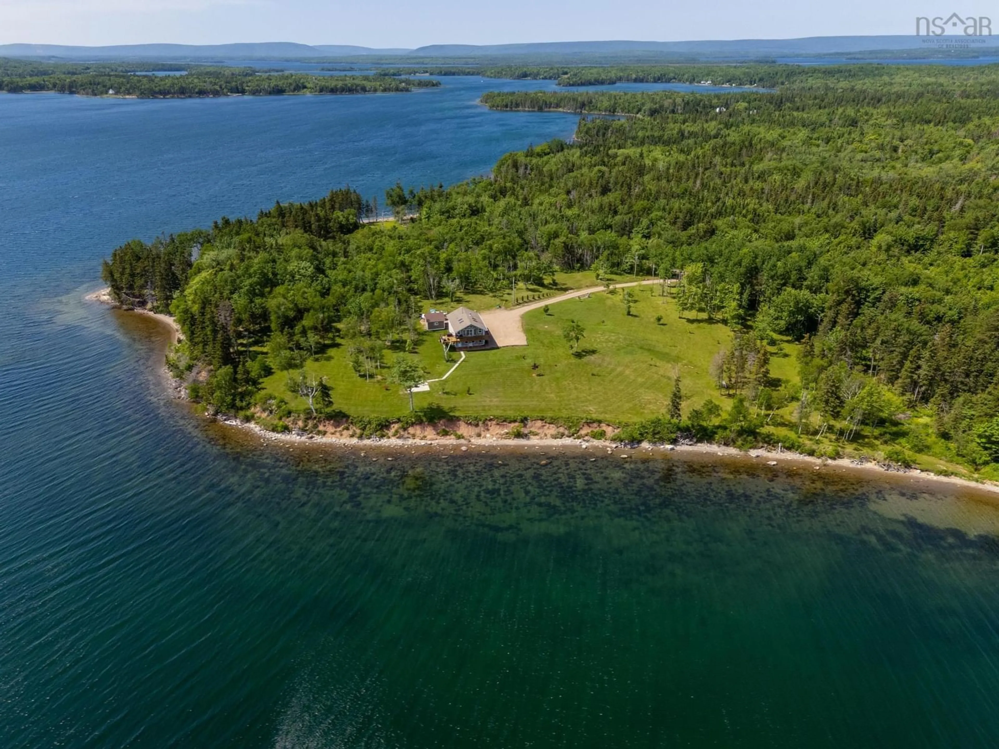 A pic from outside/outdoor area/front of a property/back of a property/a pic from drone, water/lake/river/ocean view for 1280 Big Harbour Island Rd, River Denys Nova Scotia B0E 2Y0