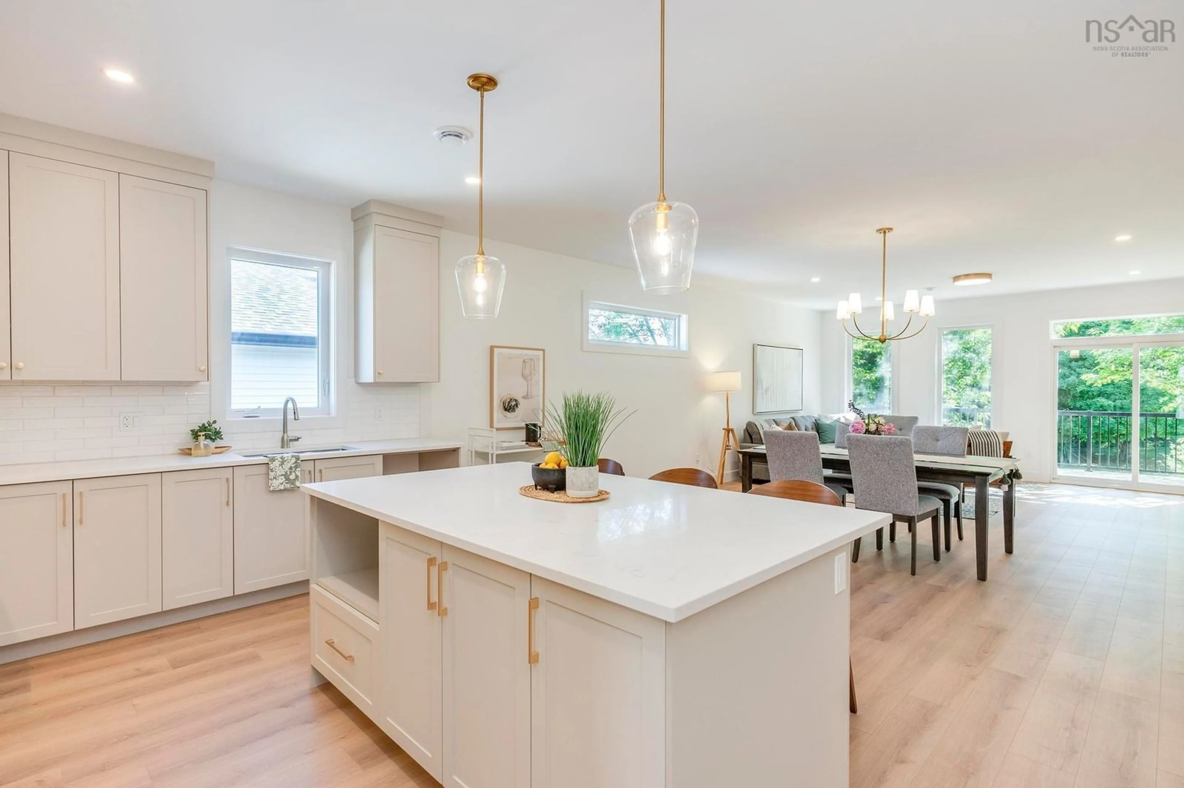 Open concept kitchen, wood/laminate floor for 18 Whidden Ave, Wolfville Nova Scotia B4P 0A8