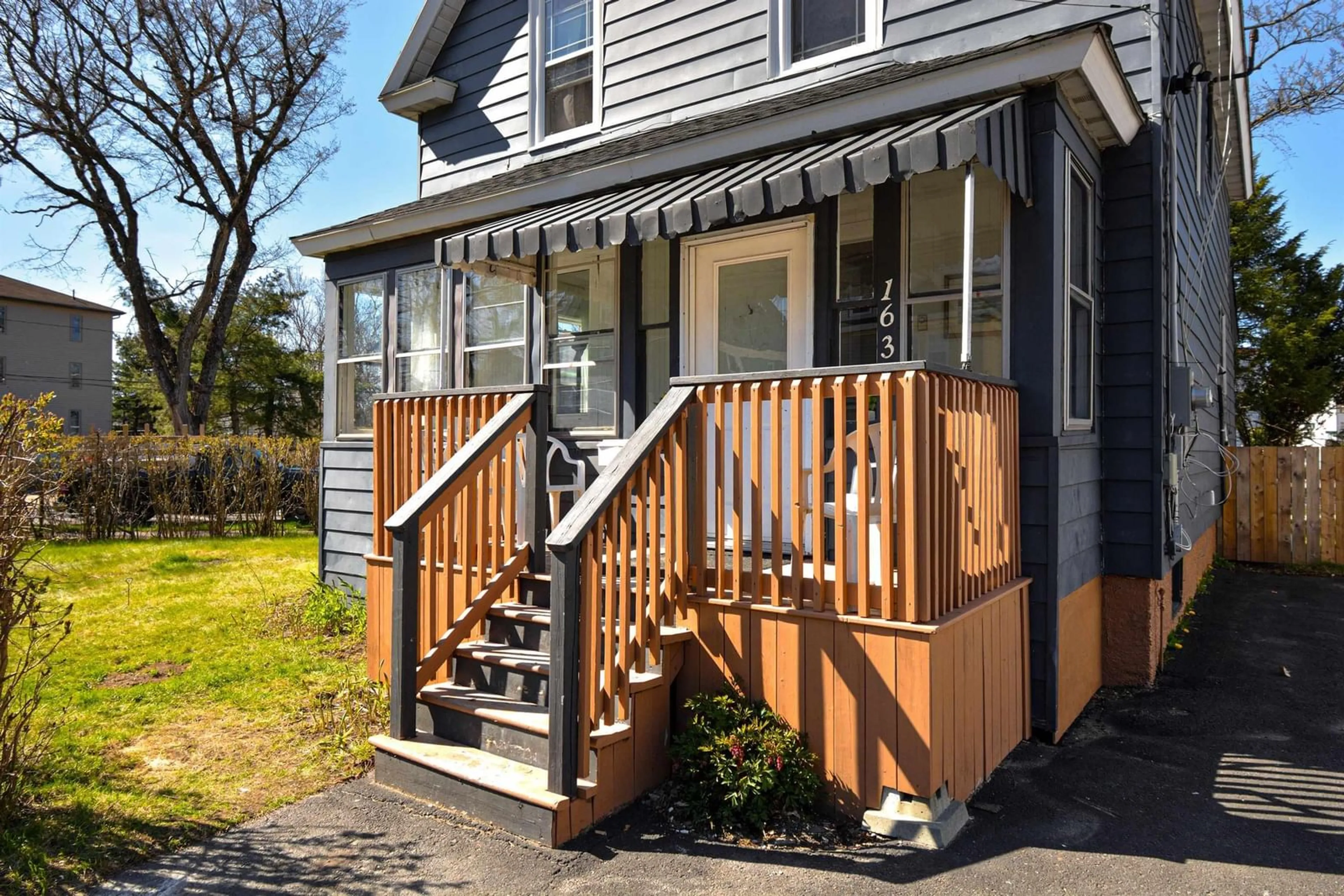 Home with vinyl exterior material, street for 163 Brookland St, Sydney Nova Scotia B1P 5B7