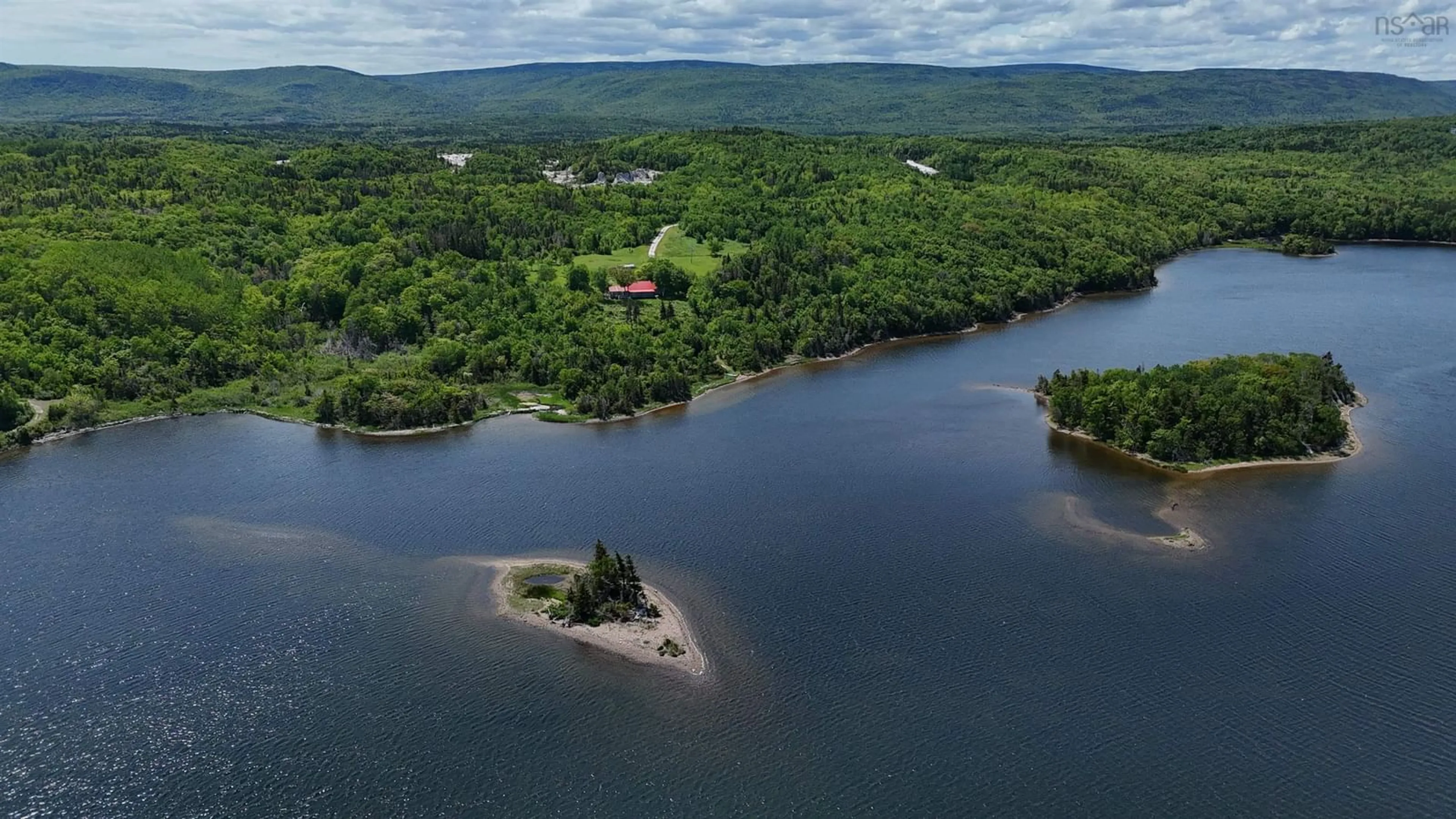 A pic from outside/outdoor area/front of a property/back of a property/a pic from drone, water/lake/river/ocean view for 340 Mountain View Rd, Dingwall Nova Scotia B0C 1G0