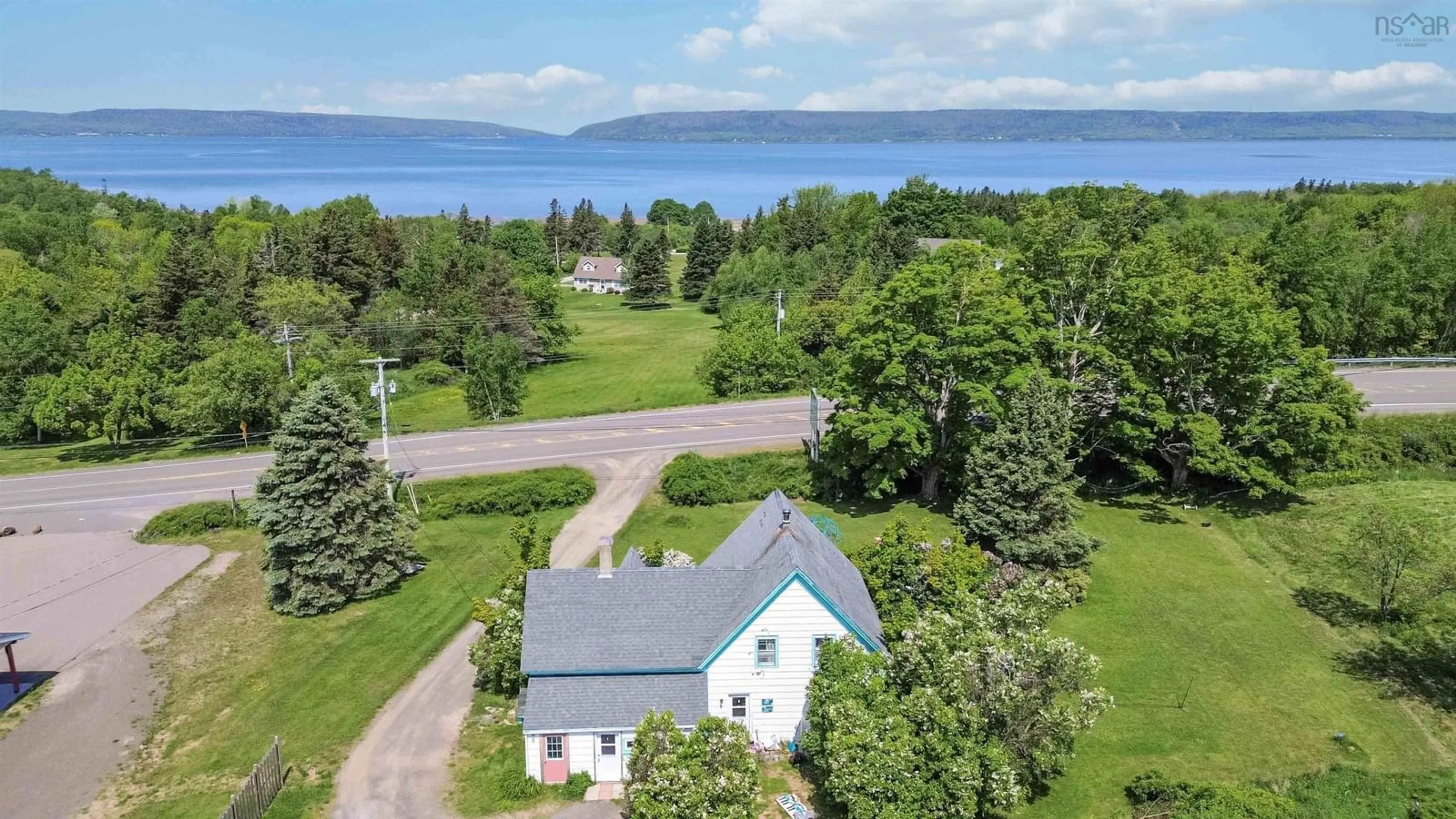 A pic from outside/outdoor area/front of a property/back of a property/a pic from drone, water/lake/river/ocean view for 318 Highway 1, Deep Brook Nova Scotia B0S 1J0