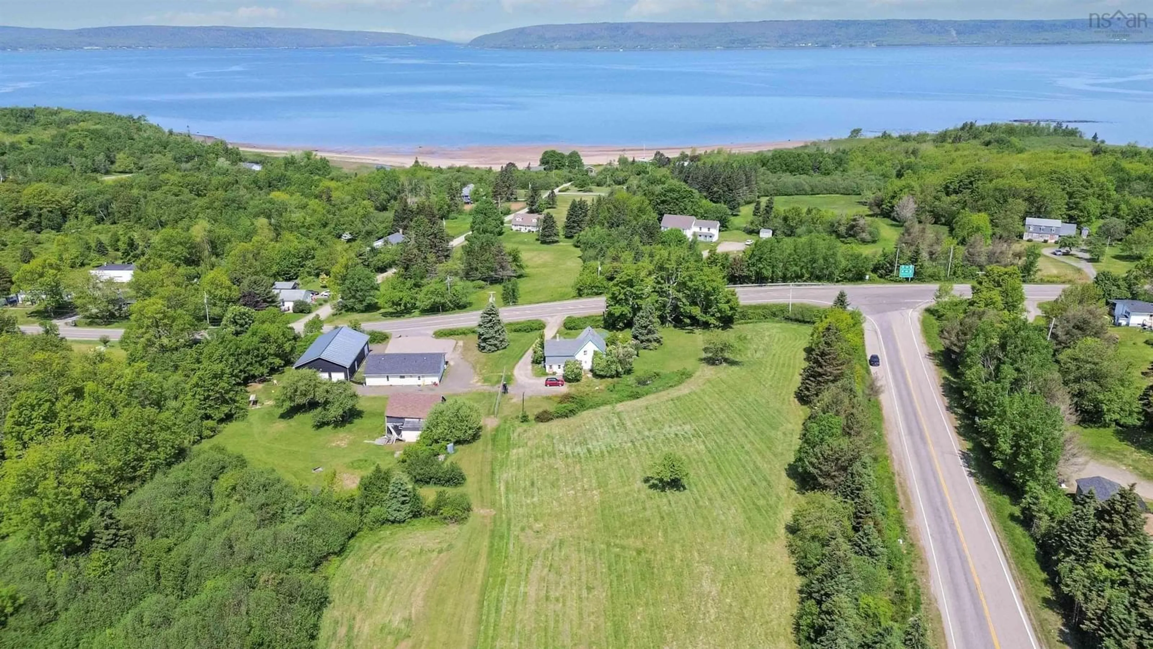 A pic from outside/outdoor area/front of a property/back of a property/a pic from drone, water/lake/river/ocean view for 318 Highway 1, Deep Brook Nova Scotia B0S 1J0