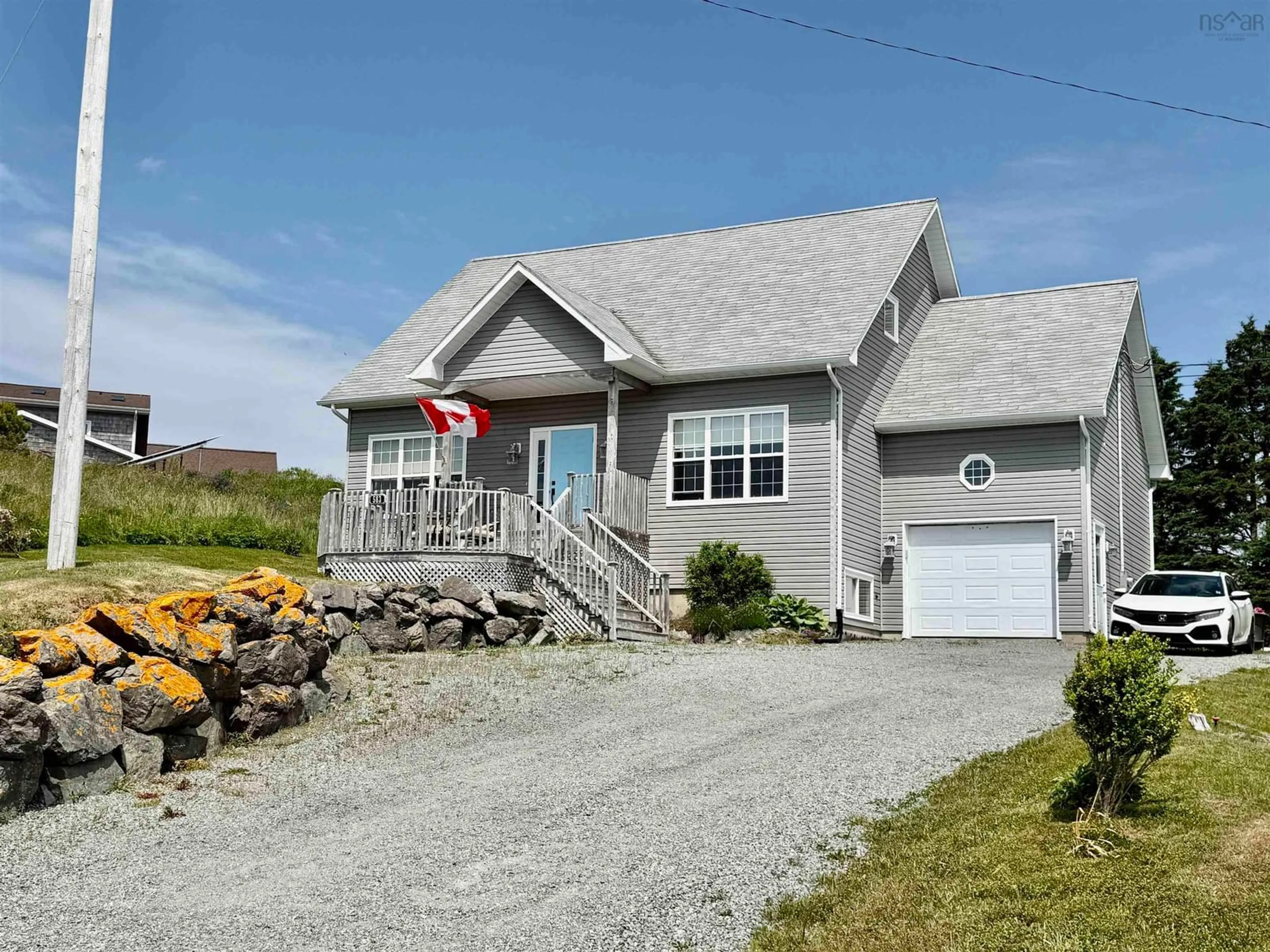 Home with vinyl exterior material, street for 583 Veterans Memorial Dr, Arichat Nova Scotia B0E 1A0