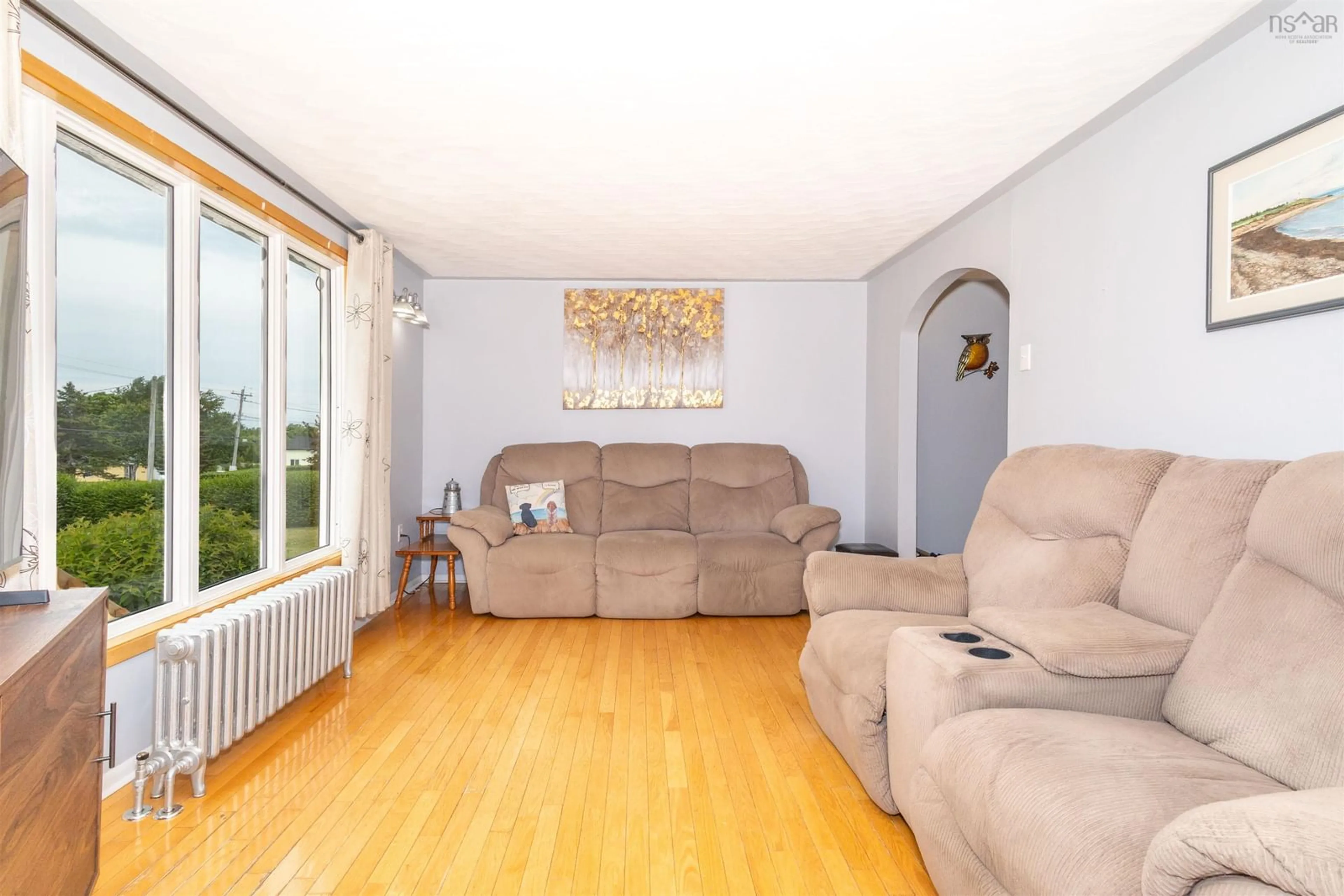 Living room with furniture, wood/laminate floor for 3 Browns Rd, New Victoria Nova Scotia B1H 4Y4
