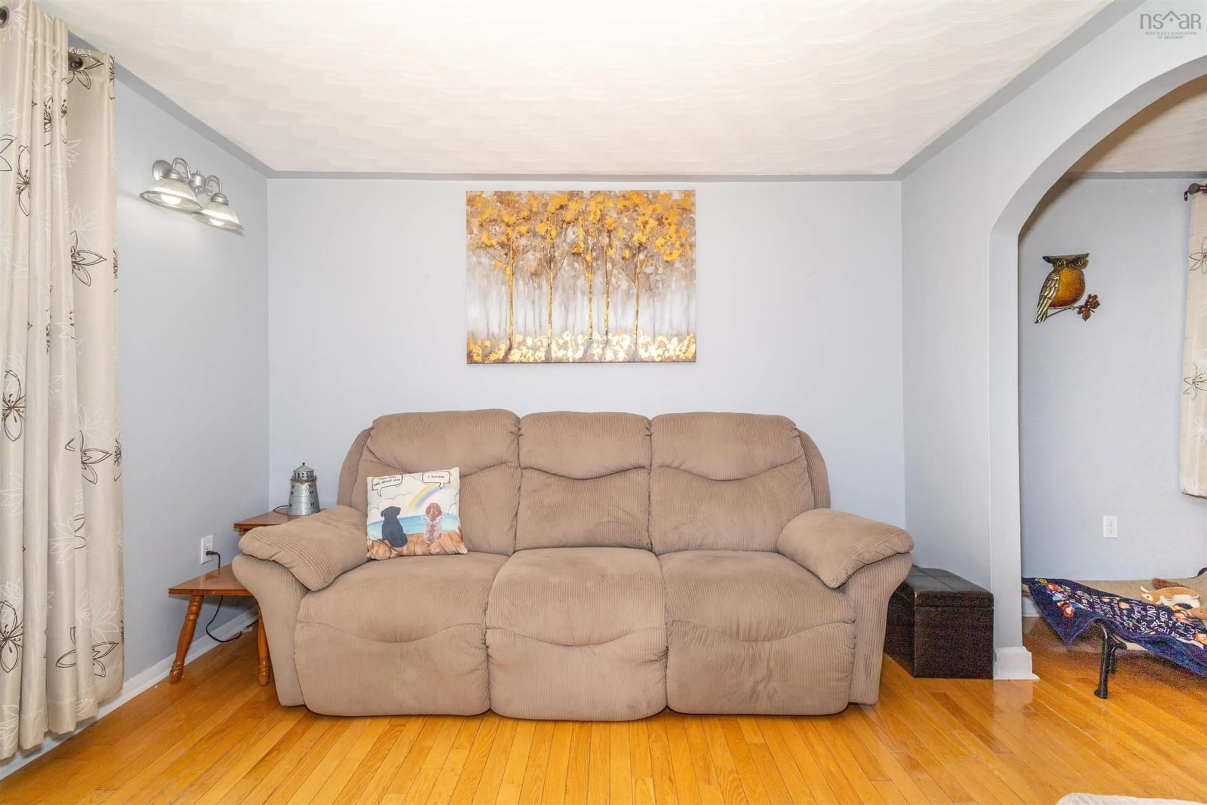 Living room with furniture, wood/laminate floor for 3 Browns Rd, New Victoria Nova Scotia B1H 4Y4