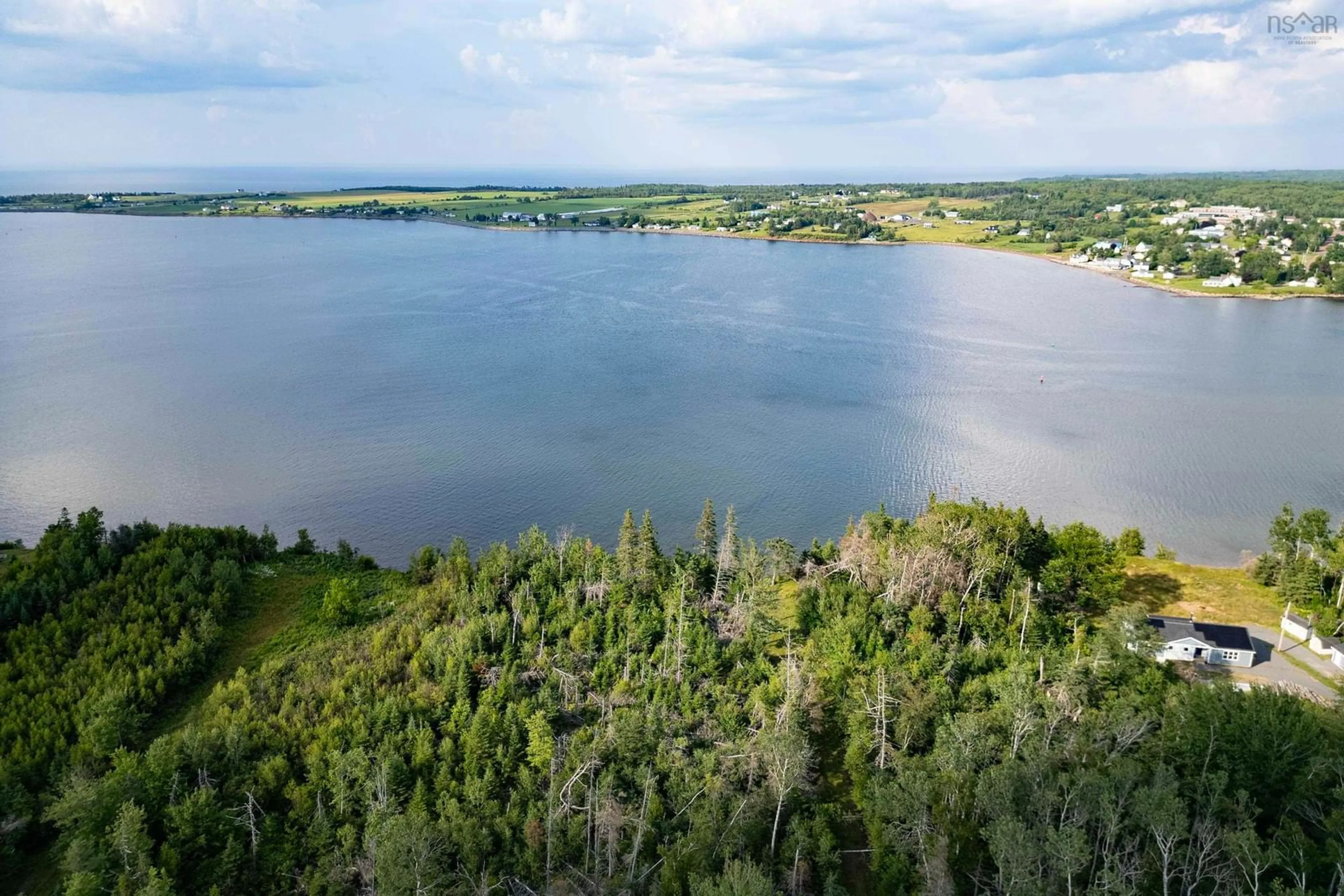 A pic from outside/outdoor area/front of a property/back of a property/a pic from drone, water/lake/river/ocean view for 9525 Highway 6, Pugwash Nova Scotia B0K 1L0