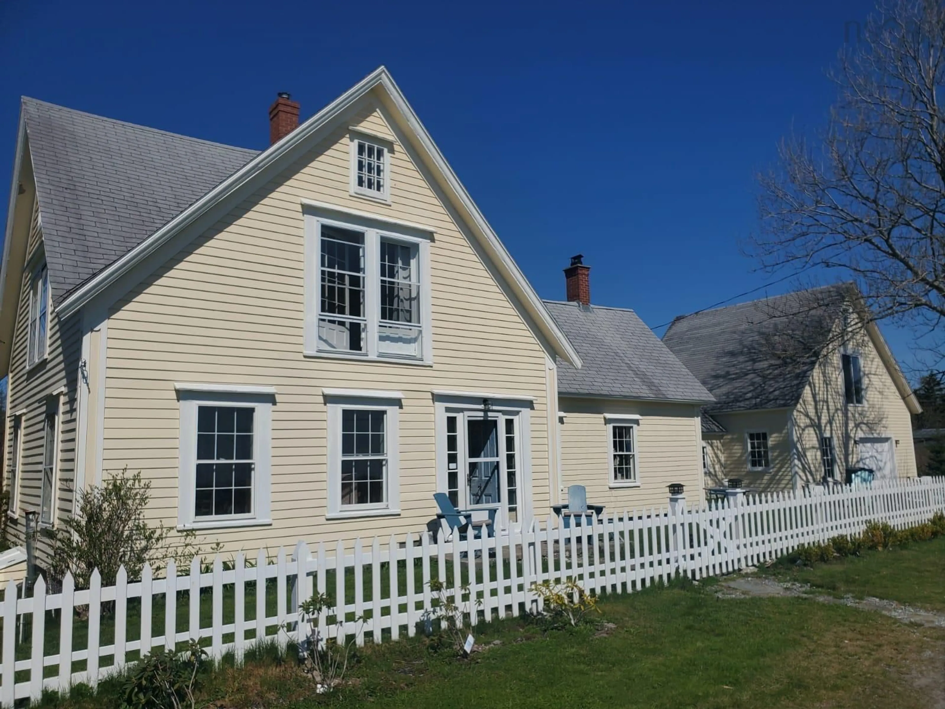 Home with vinyl exterior material, street for 5069 Shore Rd, North East Harbour Nova Scotia B0T 1W0