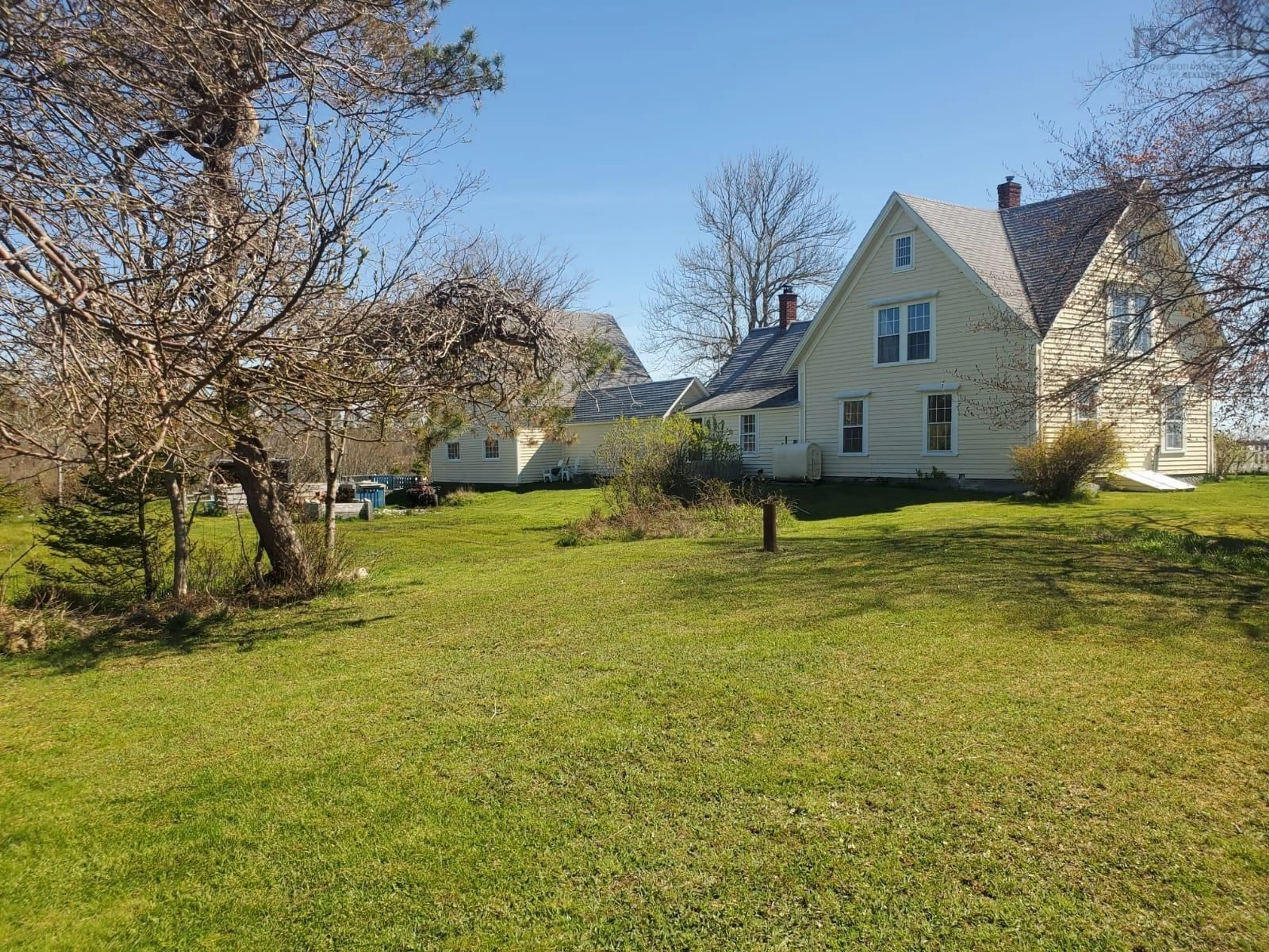 A pic from outside/outdoor area/front of a property/back of a property/a pic from drone, street for 5069 Shore Rd, North East Harbour Nova Scotia B0T 1W0