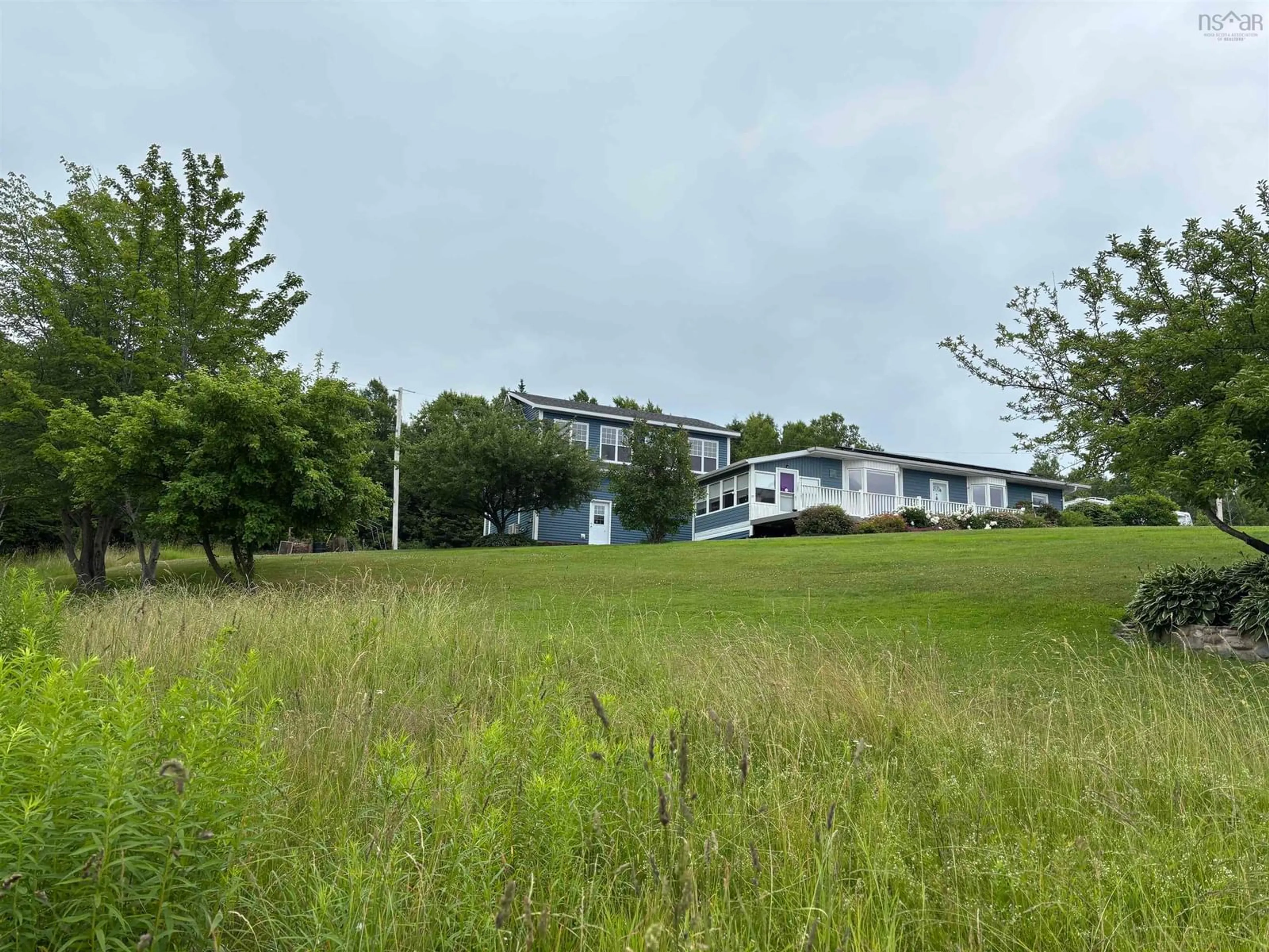 A pic from outside/outdoor area/front of a property/back of a property/a pic from drone, water/lake/river/ocean view for 7062 East Bay Highway, Big Pond Nova Scotia B1J 1T1