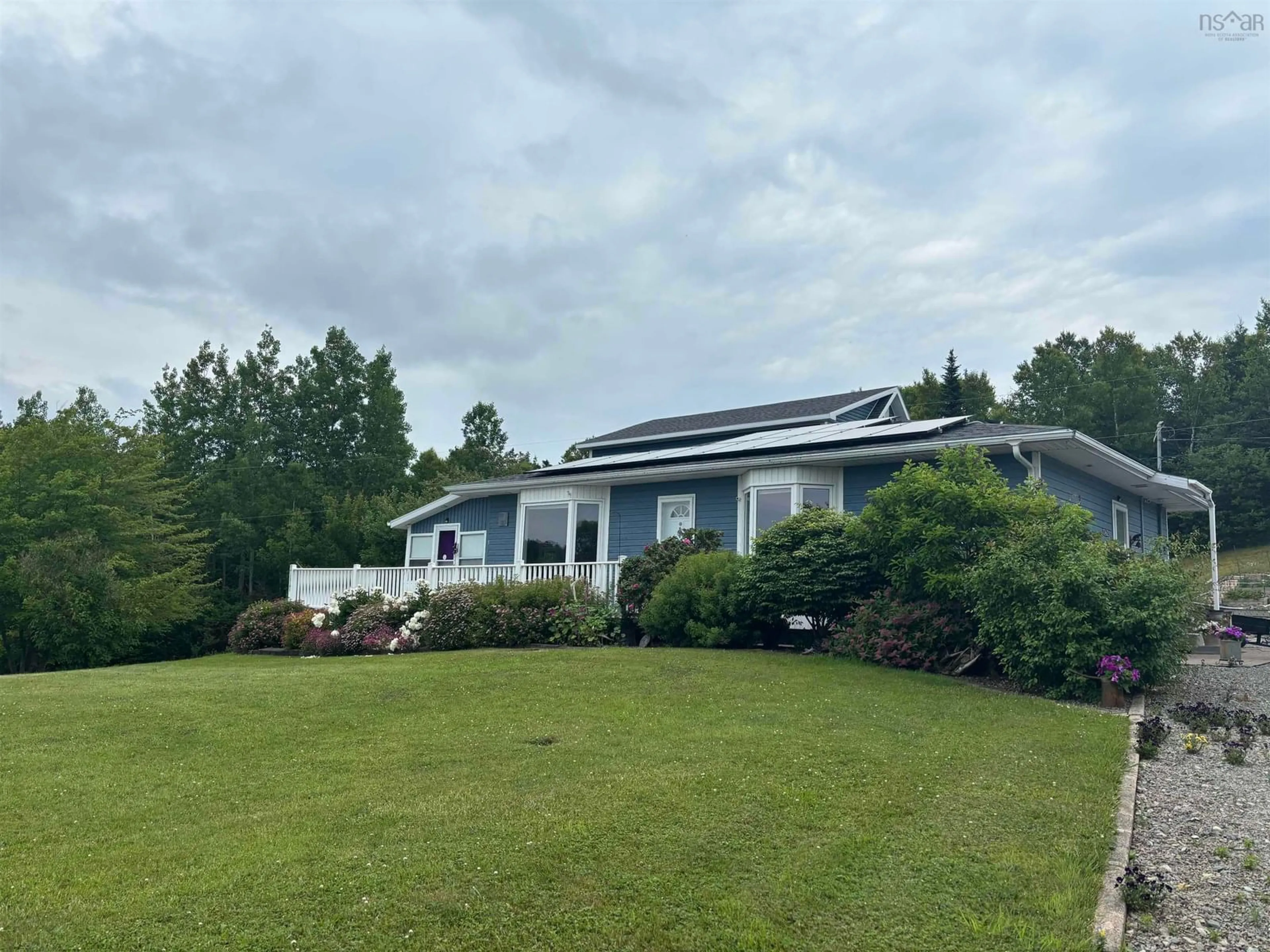 A pic from outside/outdoor area/front of a property/back of a property/a pic from drone, water/lake/river/ocean view for 7062 East Bay Highway, Big Pond Nova Scotia B1J 1T1