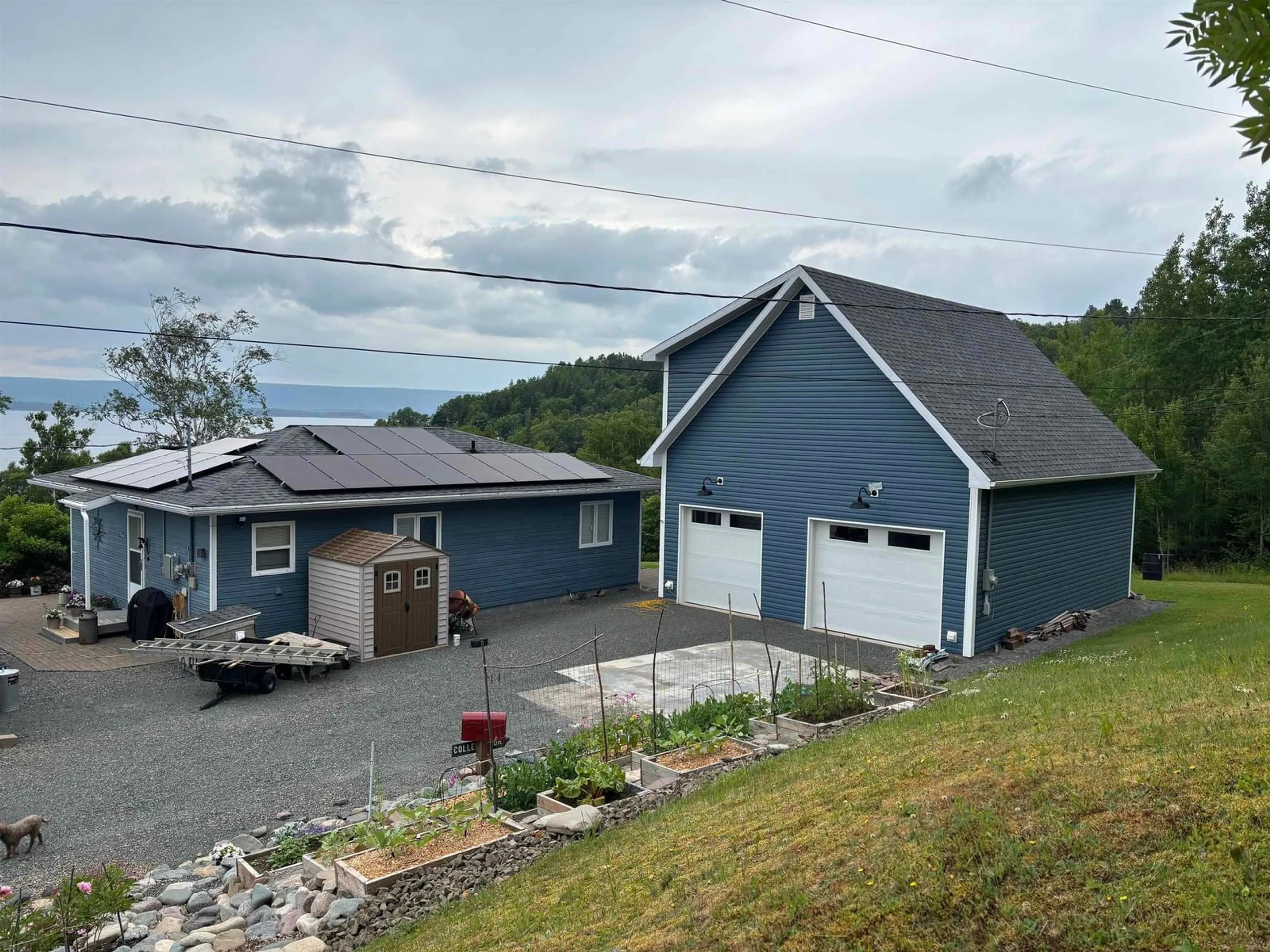 A pic from outside/outdoor area/front of a property/back of a property/a pic from drone, street for 7062 East Bay Highway, Big Pond Nova Scotia B1J 1T1