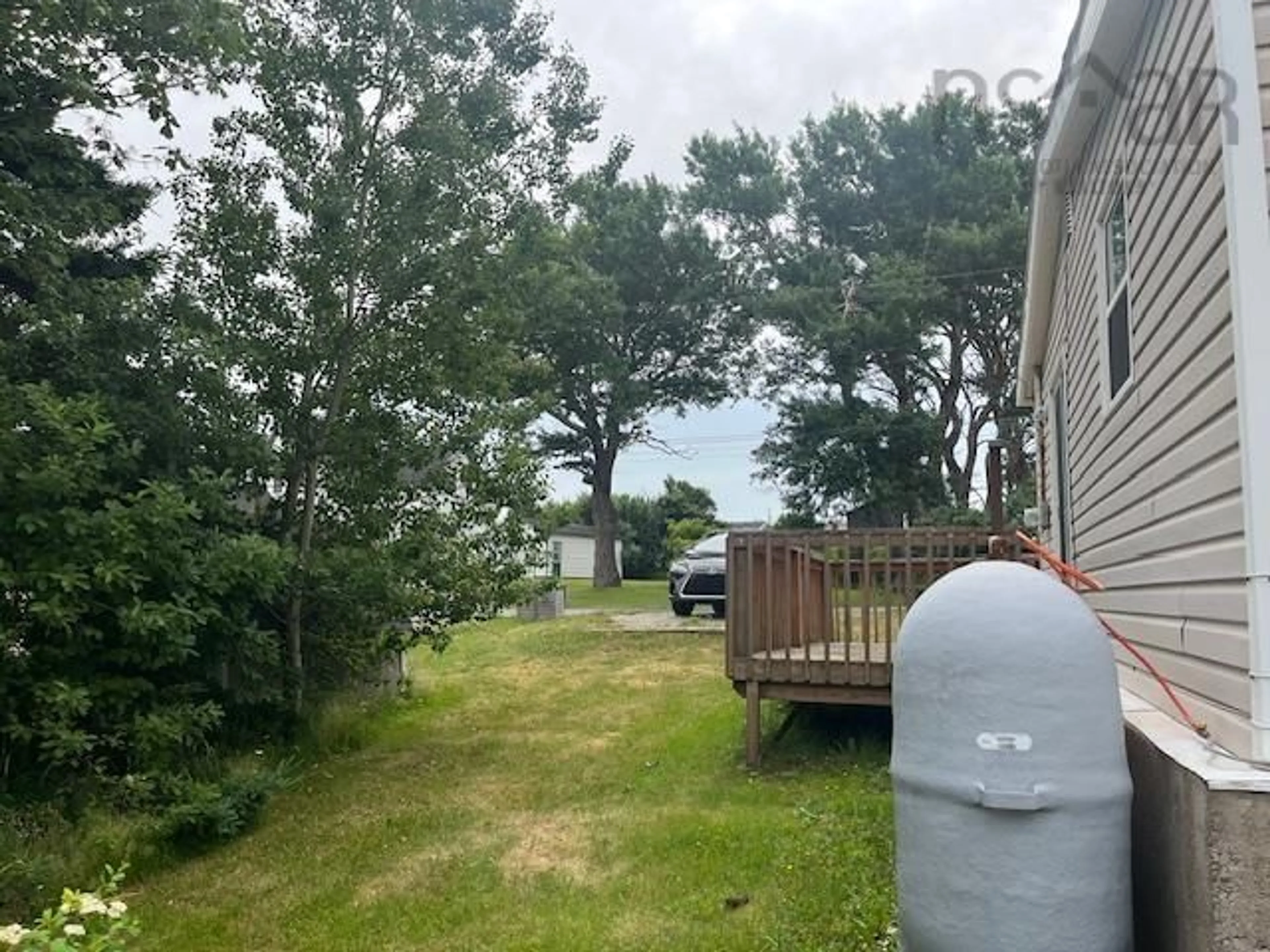 A pic from outside/outdoor area/front of a property/back of a property/a pic from drone, water/lake/river/ocean view for 87 Church St, Inverness Nova Scotia B0E 1N0