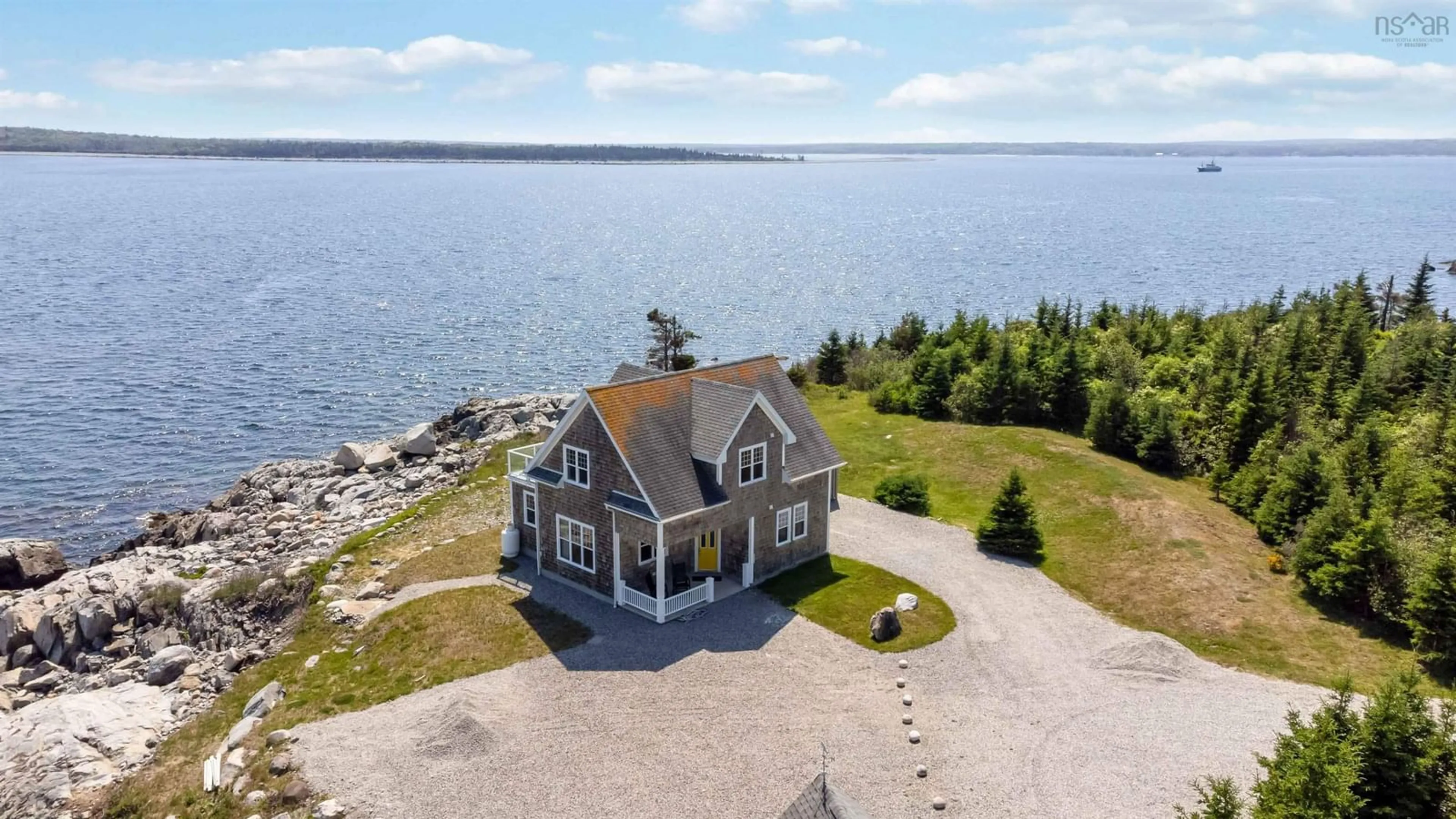 A pic from outside/outdoor area/front of a property/back of a property/a pic from drone, water/lake/river/ocean view for 24 Partridge Lane, Lower Sandy Point Nova Scotia B0T 1W0