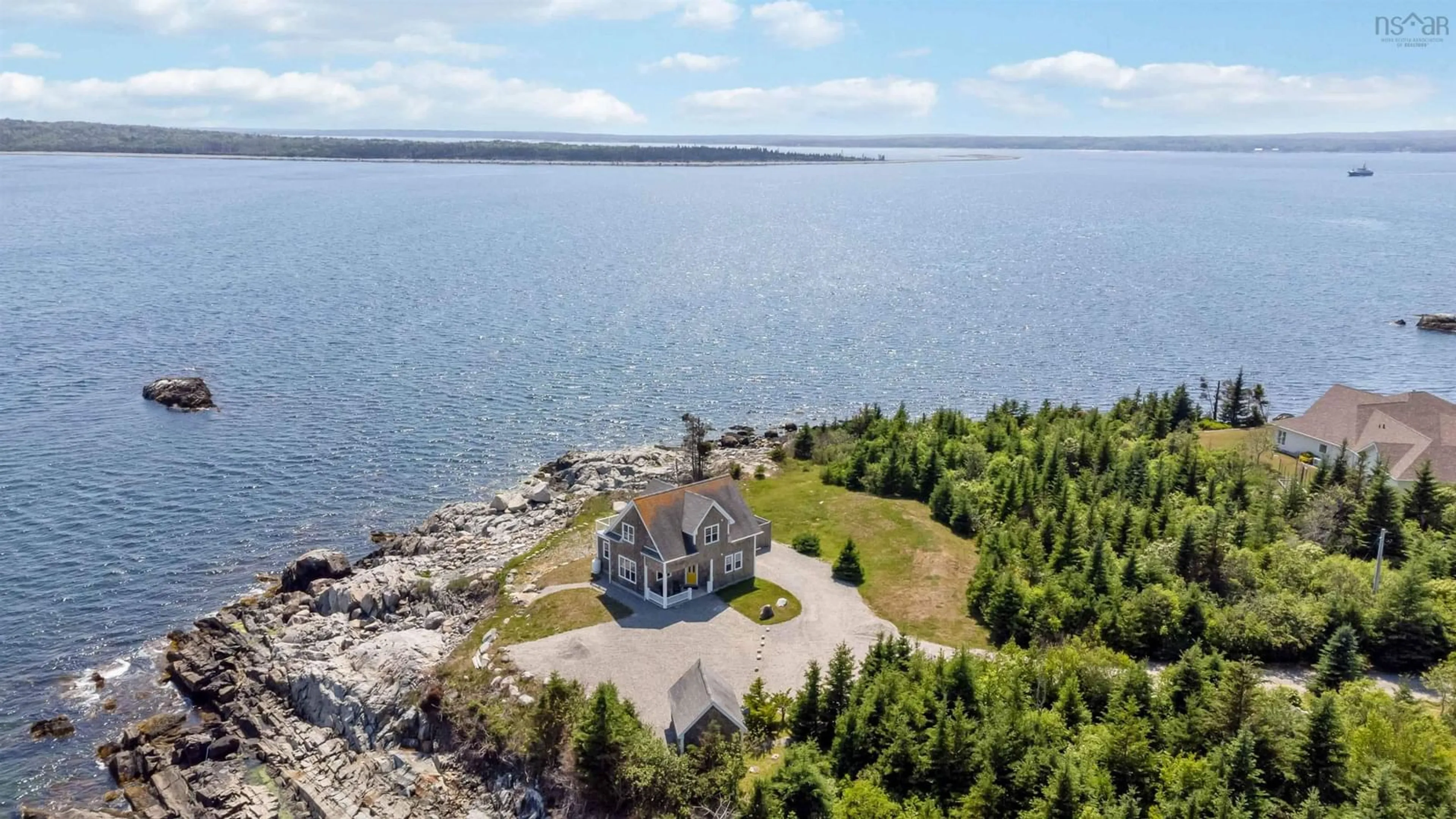 A pic from outside/outdoor area/front of a property/back of a property/a pic from drone, water/lake/river/ocean view for 24 Partridge Lane, Lower Sandy Point Nova Scotia B0T 1W0