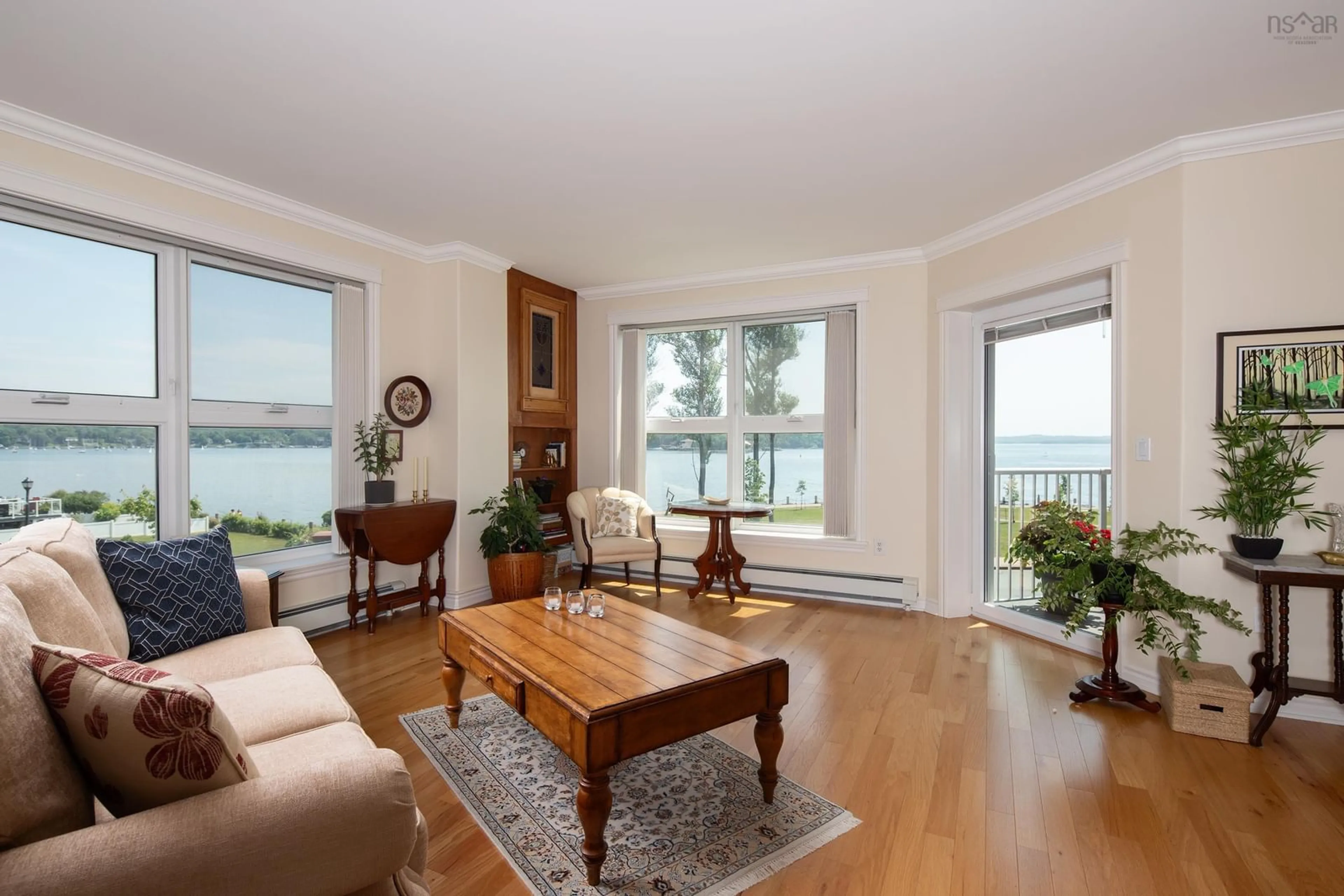 Living room with furniture, wood/laminate floor for 99 Waterfront Dr #204, Bedford Nova Scotia B4A 4K4