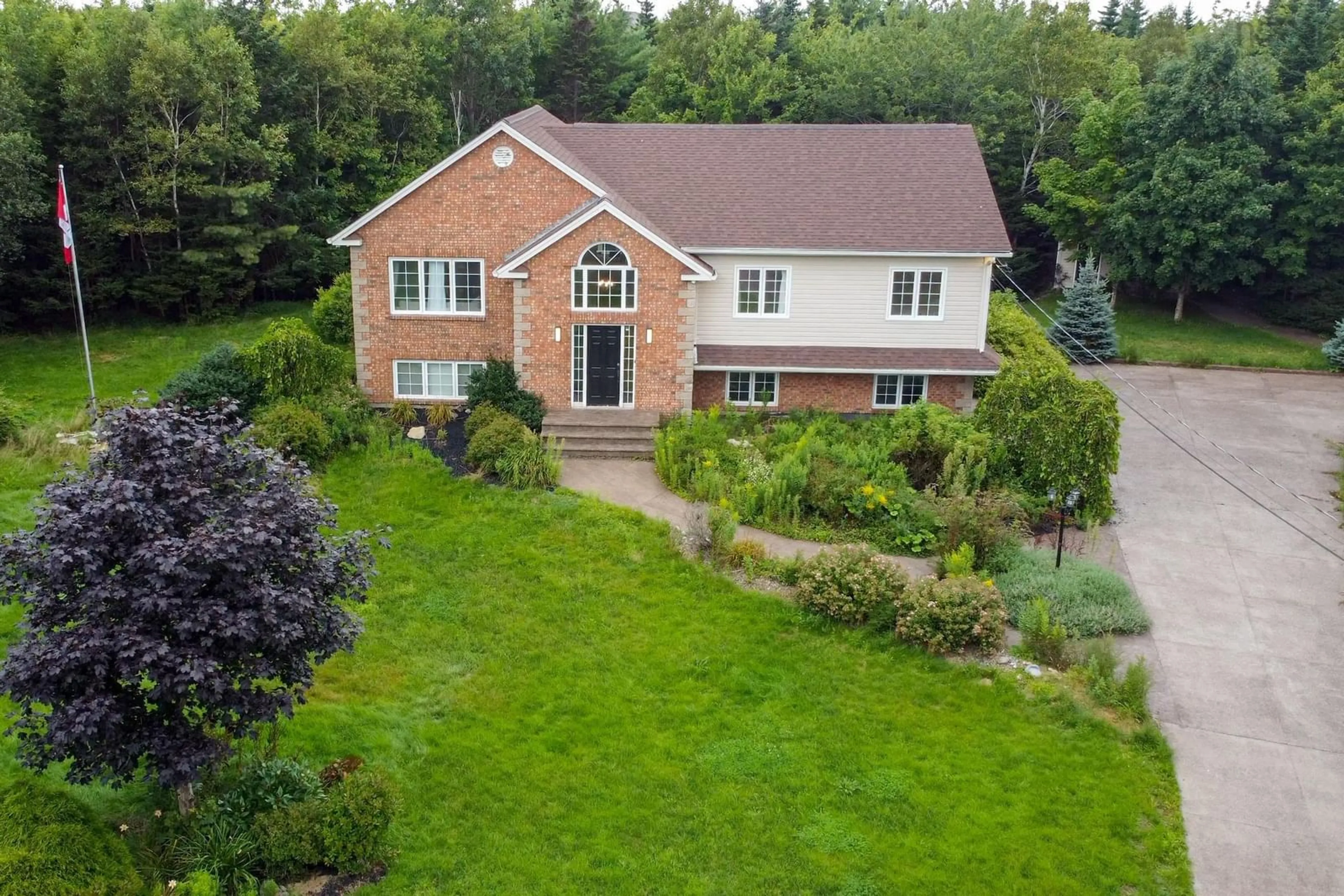 A pic from outside/outdoor area/front of a property/back of a property/a pic from drone, unknown for 34 Terradore Lane, Hammonds Plains Nova Scotia B4B 1S7