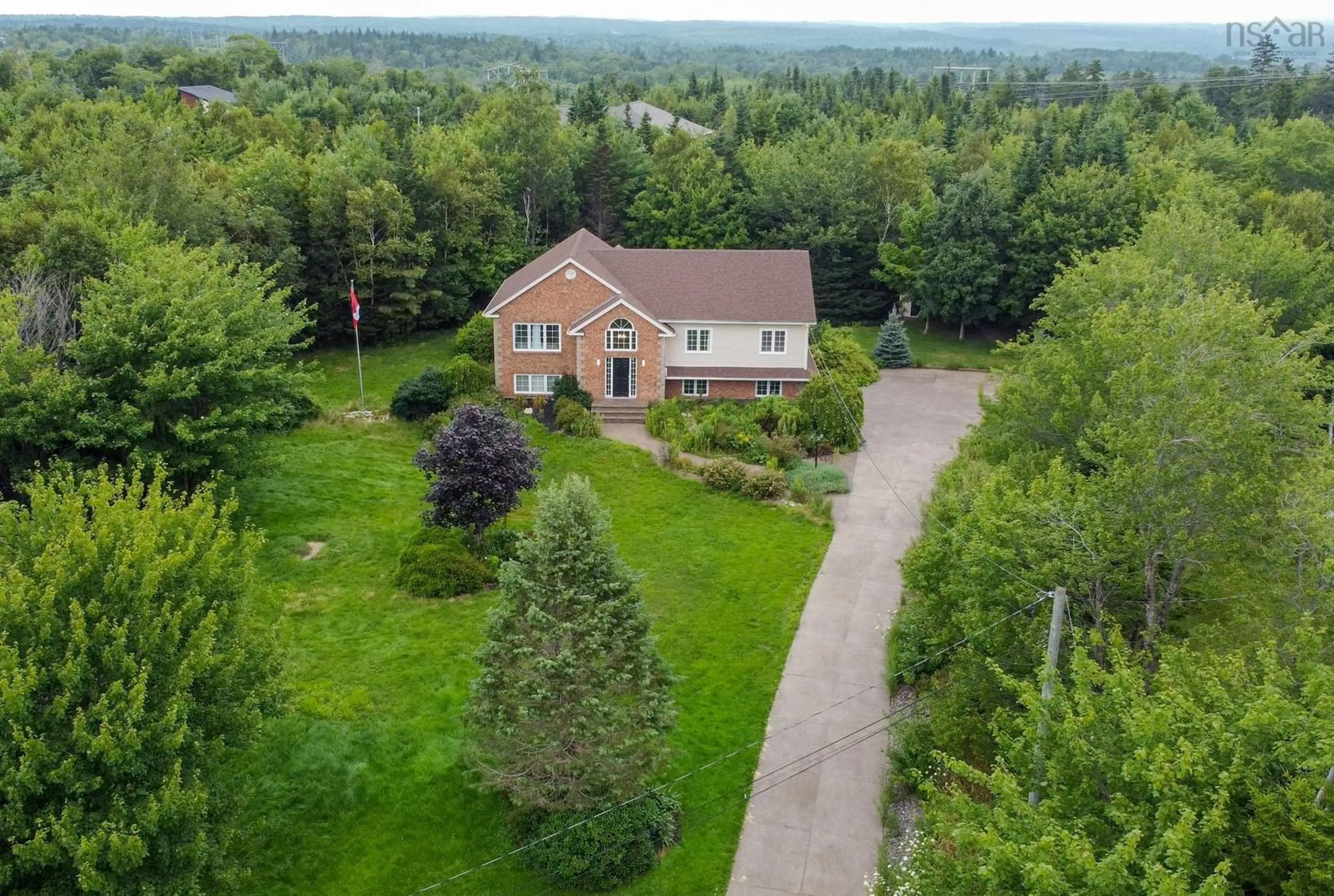 A pic from outside/outdoor area/front of a property/back of a property/a pic from drone, unknown for 34 Terradore Lane, Hammonds Plains Nova Scotia B4B 1S7