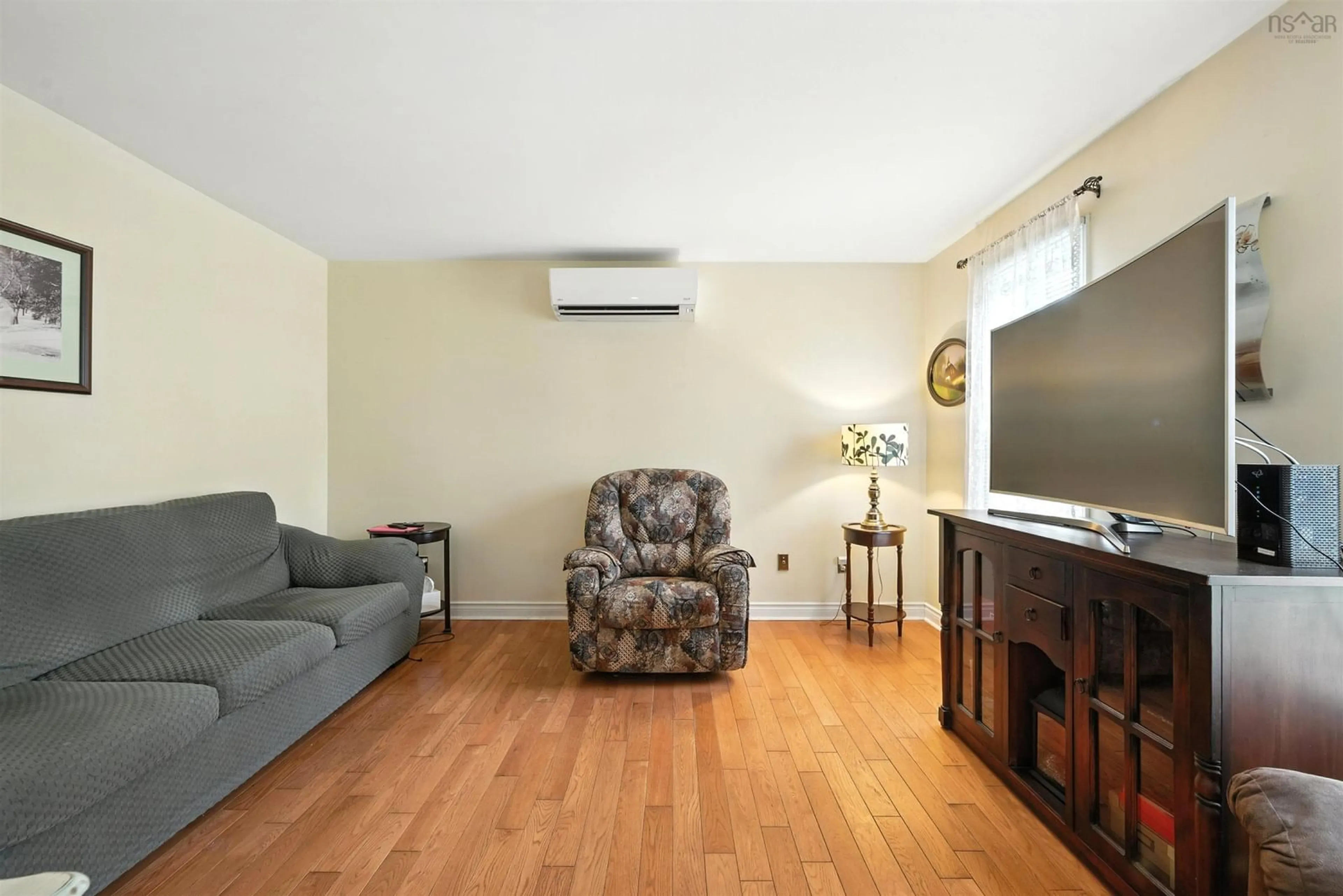 Living room with furniture, wood/laminate floor for 74 Bruce Dr, Lower Sackville Nova Scotia B4C 3T8