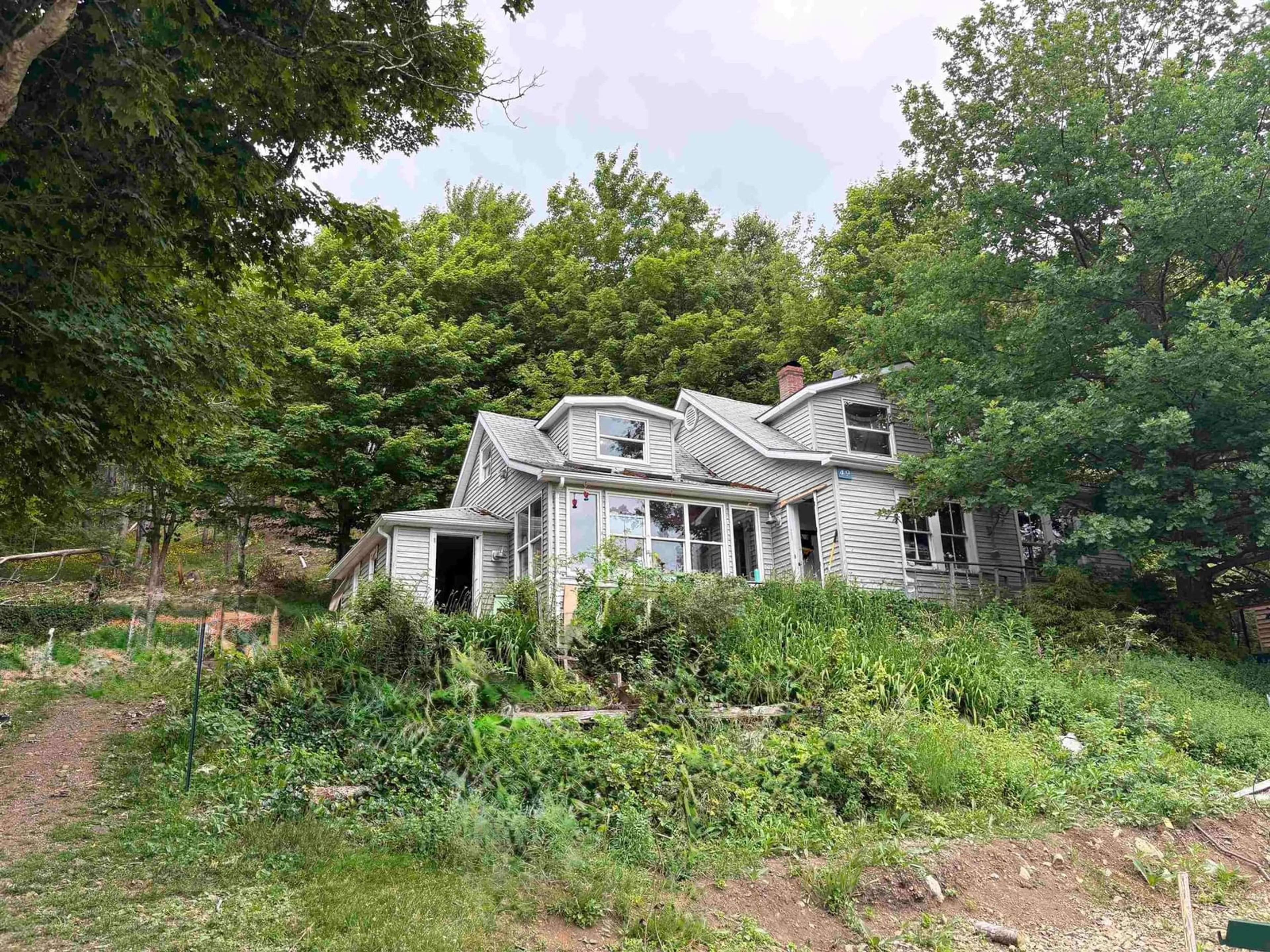 A pic from outside/outdoor area/front of a property/back of a property/a pic from drone, unknown for 49 Rear Barachois Rd., Englishtown Nova Scotia B0E 1B0