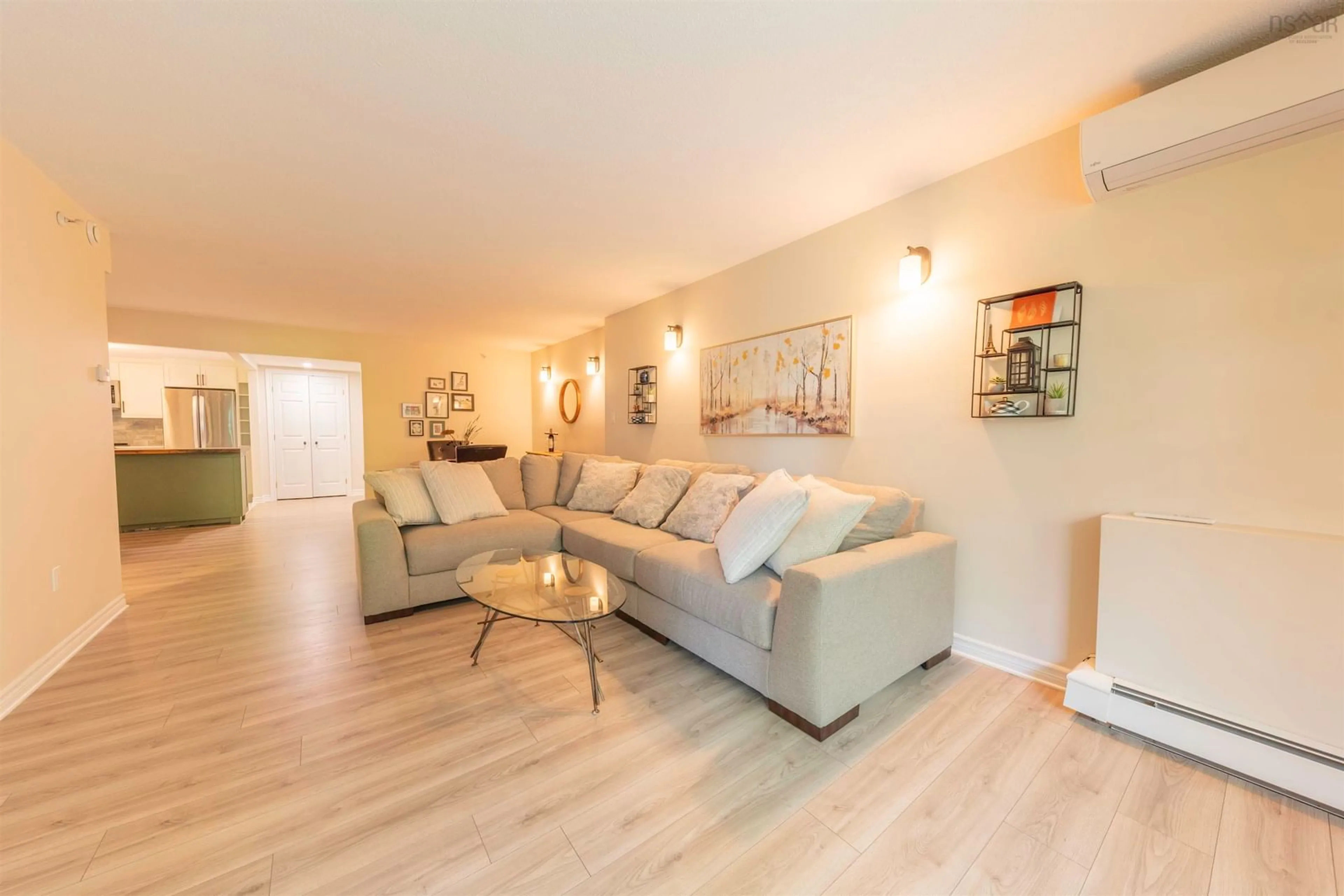 Living room with furniture, wood/laminate floor for 1041 Wellington St #100, Halifax Nova Scotia B3H 4P5