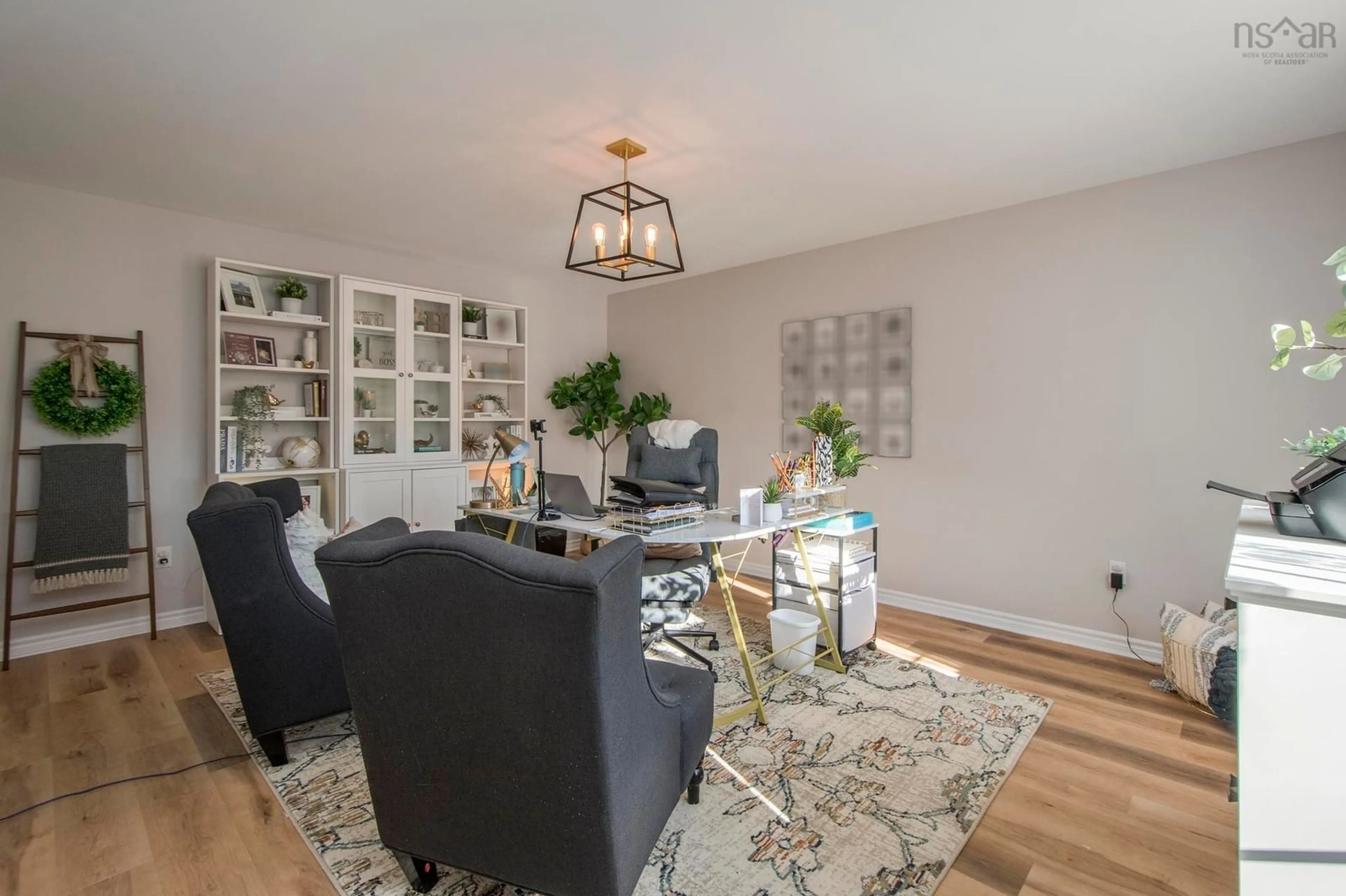 Living room with furniture, wood/laminate floor for 931 King St, Windsor Nova Scotia B0N 2T0