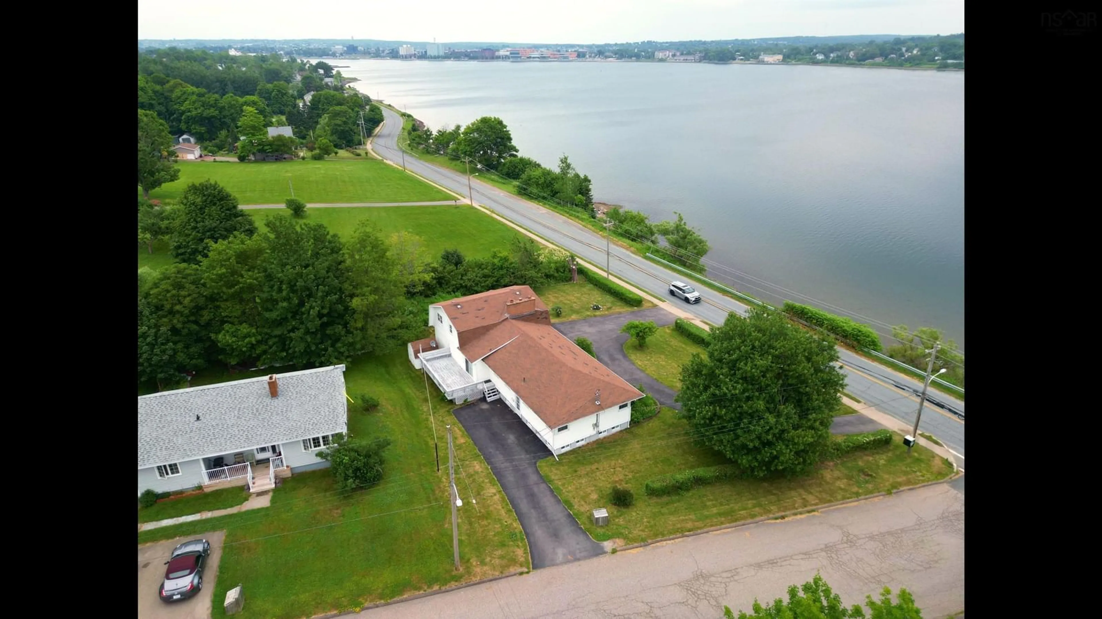A pic from outside/outdoor area/front of a property/back of a property/a pic from drone, water/lake/river/ocean view for 247 Westmount Road, Westmount Nova Scotia B1R 1A3