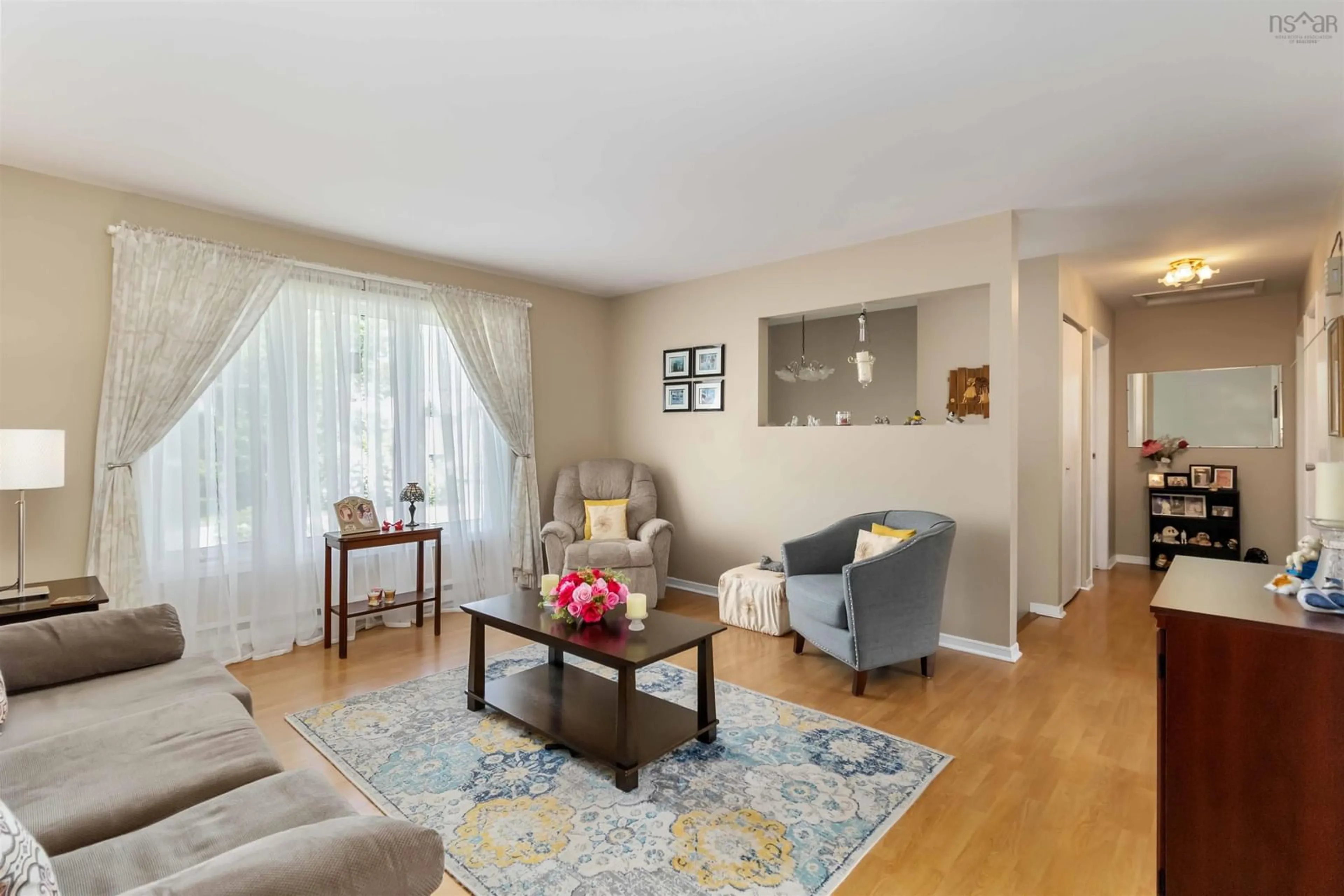 Living room with furniture, wood/laminate floor for 24 Barbara Dr, Dartmouth Nova Scotia B2W 3N6