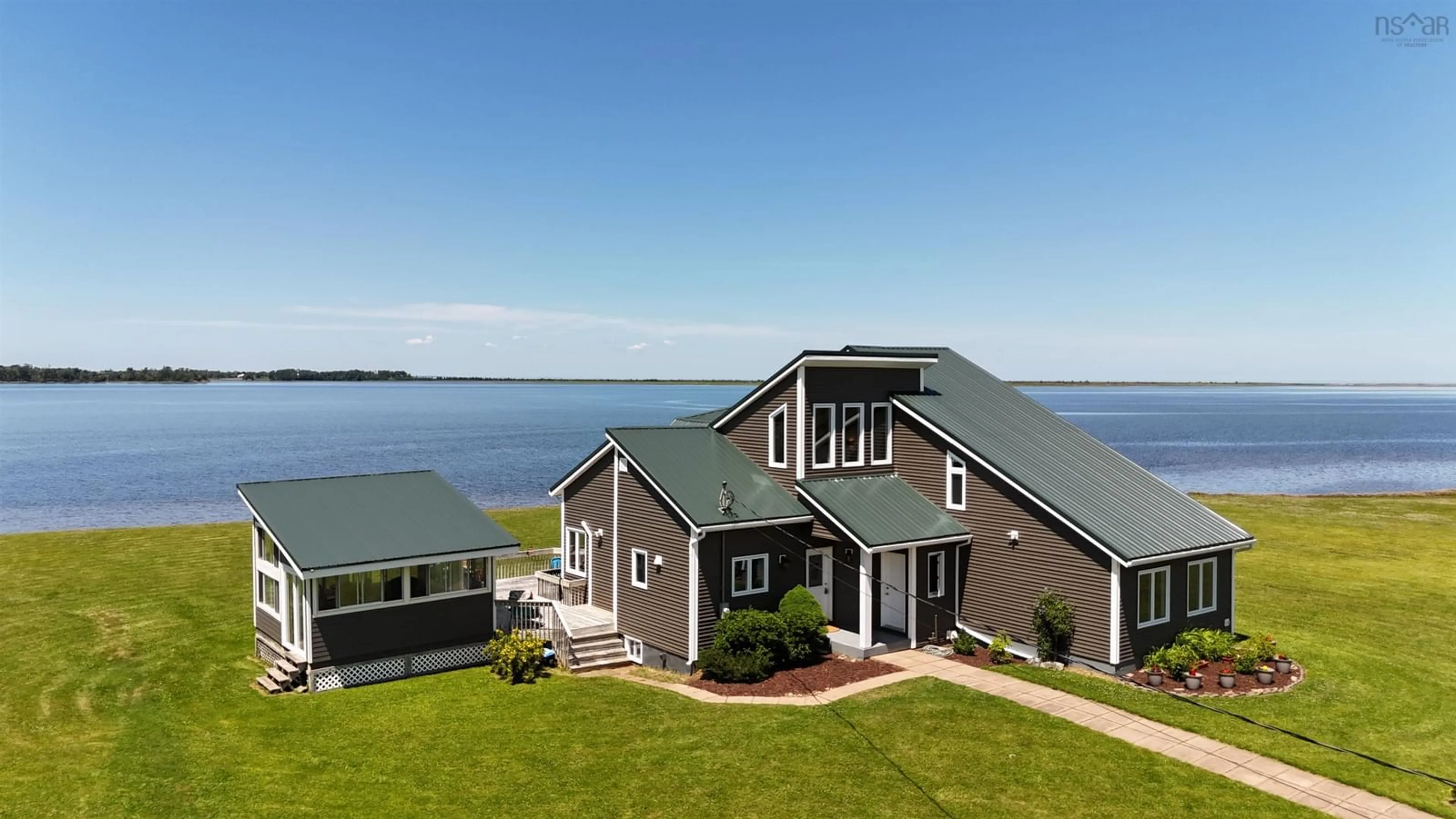 A pic from outside/outdoor area/front of a property/back of a property/a pic from drone, water/lake/river/ocean view for 2517 Shore Rd, Lower Barneys River Nova Scotia B0K 1G0