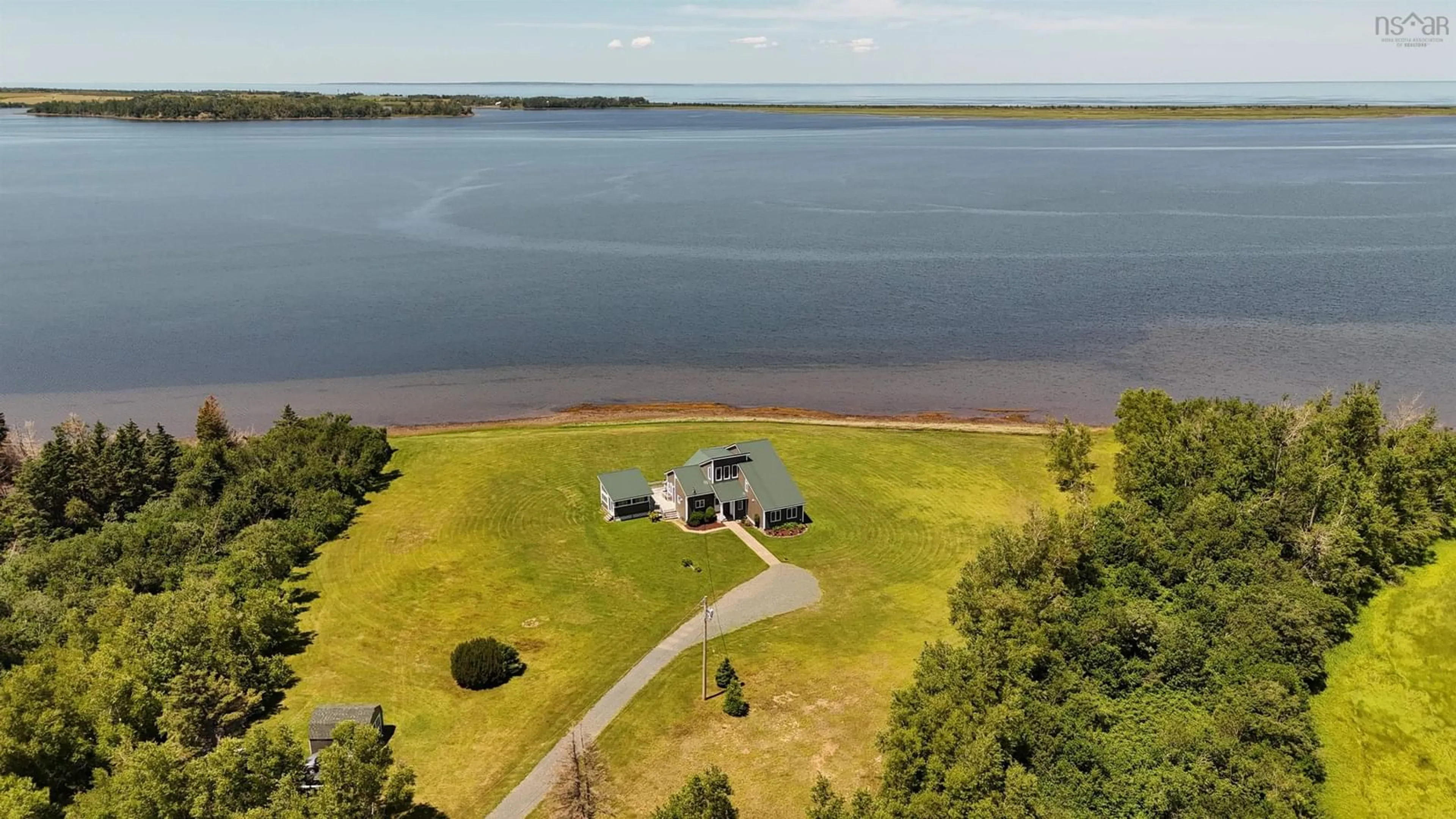 A pic from outside/outdoor area/front of a property/back of a property/a pic from drone, water/lake/river/ocean view for 2517 Shore Rd, Lower Barneys River Nova Scotia B0K 1G0