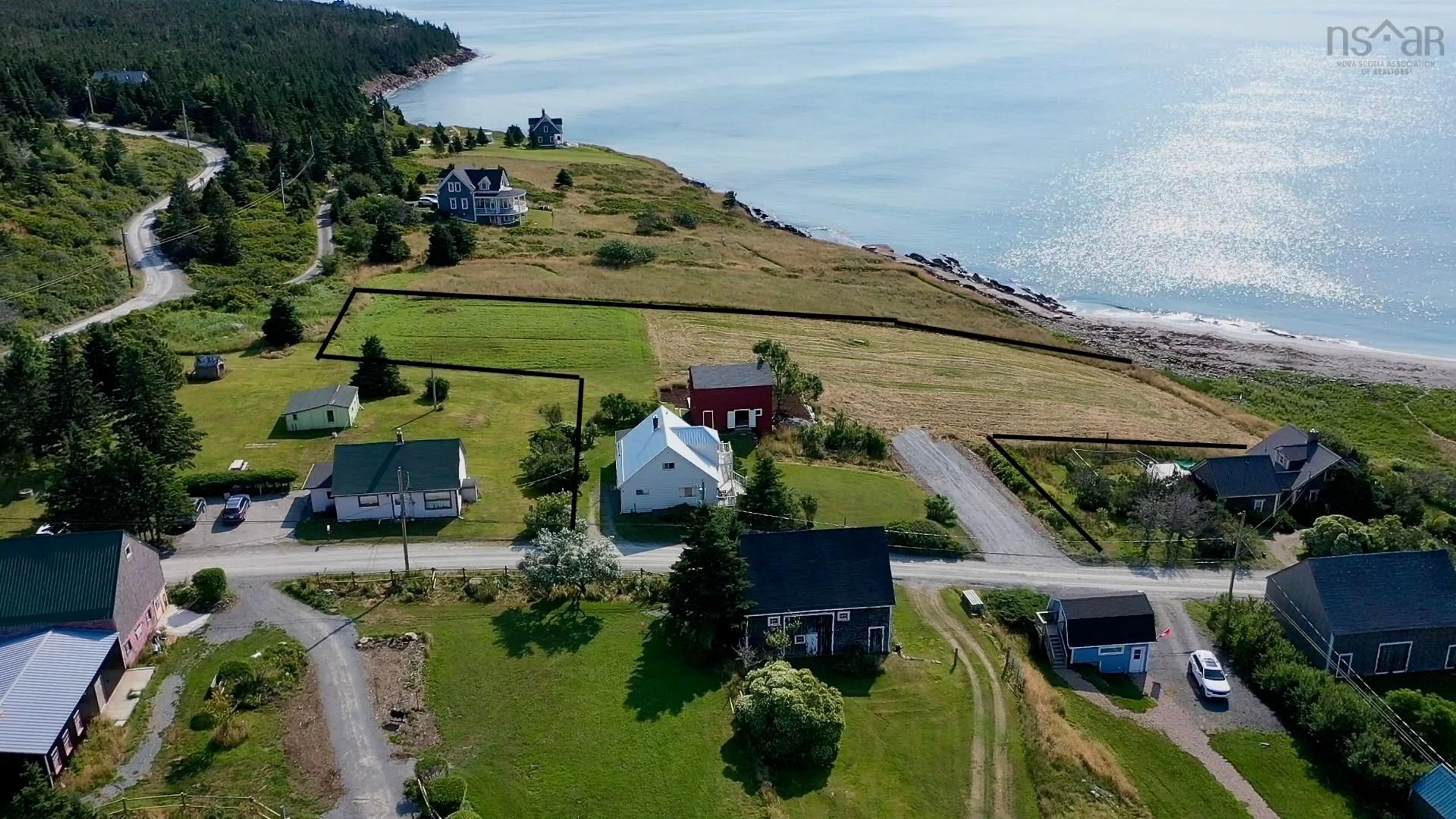 A pic from outside/outdoor area/front of a property/back of a property/a pic from drone, water/lake/river/ocean view for 85 Mosher Rd, Kingsburg Nova Scotia B0J 2C0