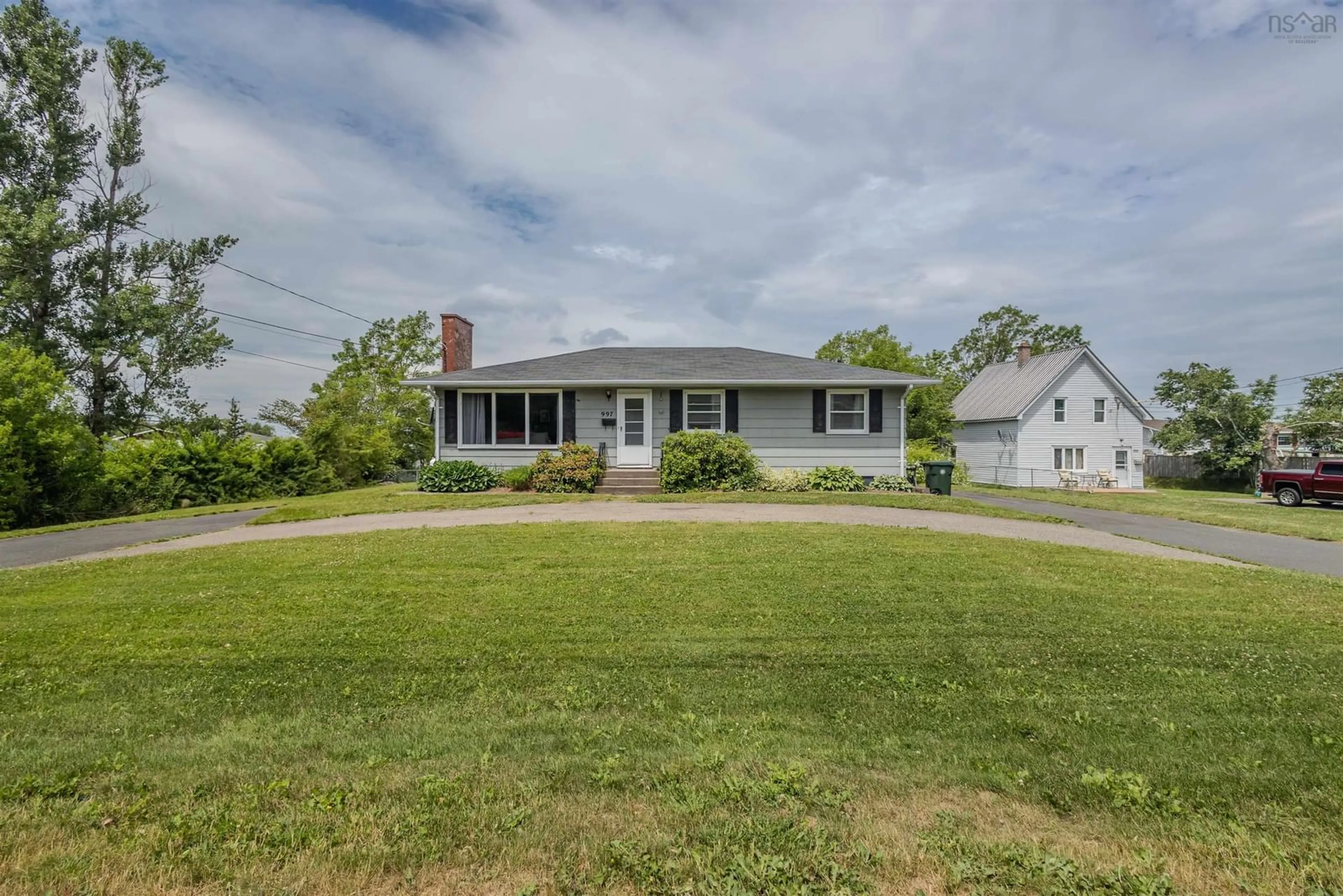 A pic from outside/outdoor area/front of a property/back of a property/a pic from drone, street for 997 Upper Prince St, Sydney Nova Scotia B1P 5P3